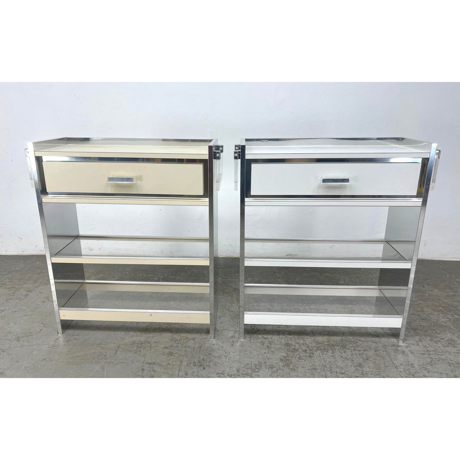 2pcs 70s Modern Server Bars with Drawer. Silver and lucite with handles.: 2pcs 70s Modern Server Bars with Drawer. Silver and lucite with handles. Dimensions: Height: 36.5 inches, Width: 33 inches, Depth: 12 inches. --- - We offer curbside delivery for most items to NYC, Ma