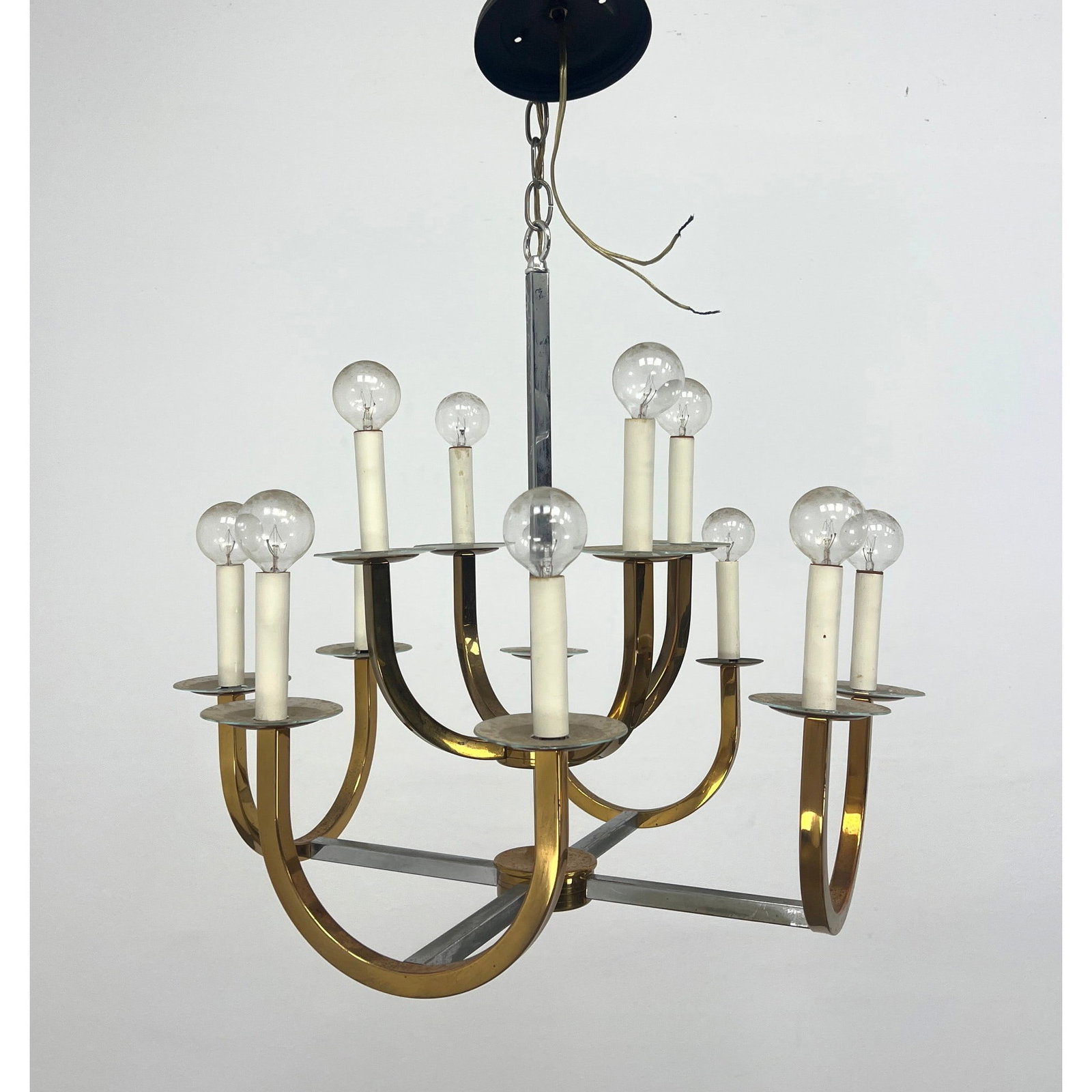 Brass Arm, Chrome Modernist Chandelier. 12 Light: Brass Arm, Chrome Modernist Chandelier. 12 Light Dimensions: Height: 22 inches, Width: 22 inches, Depth: 22 inches. - Additional Dimensions: Chain H: 18 inches --- - We offer curbside delivery for mos