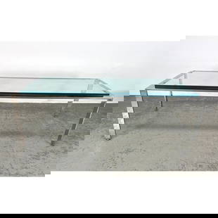 Mid Century Modern Stainless Steel Frame Modernist Coffee Table. Glass Top. Heavy thick glass.: Mid Century Modern Stainless Steel Frame Modernist Coffee Table. Glass Top. Heavy thick glass. Dimensions: Height: 18.5 inches, Width: 60 inches, Depth: 24 inches. --- - We offer curbside delivery for
