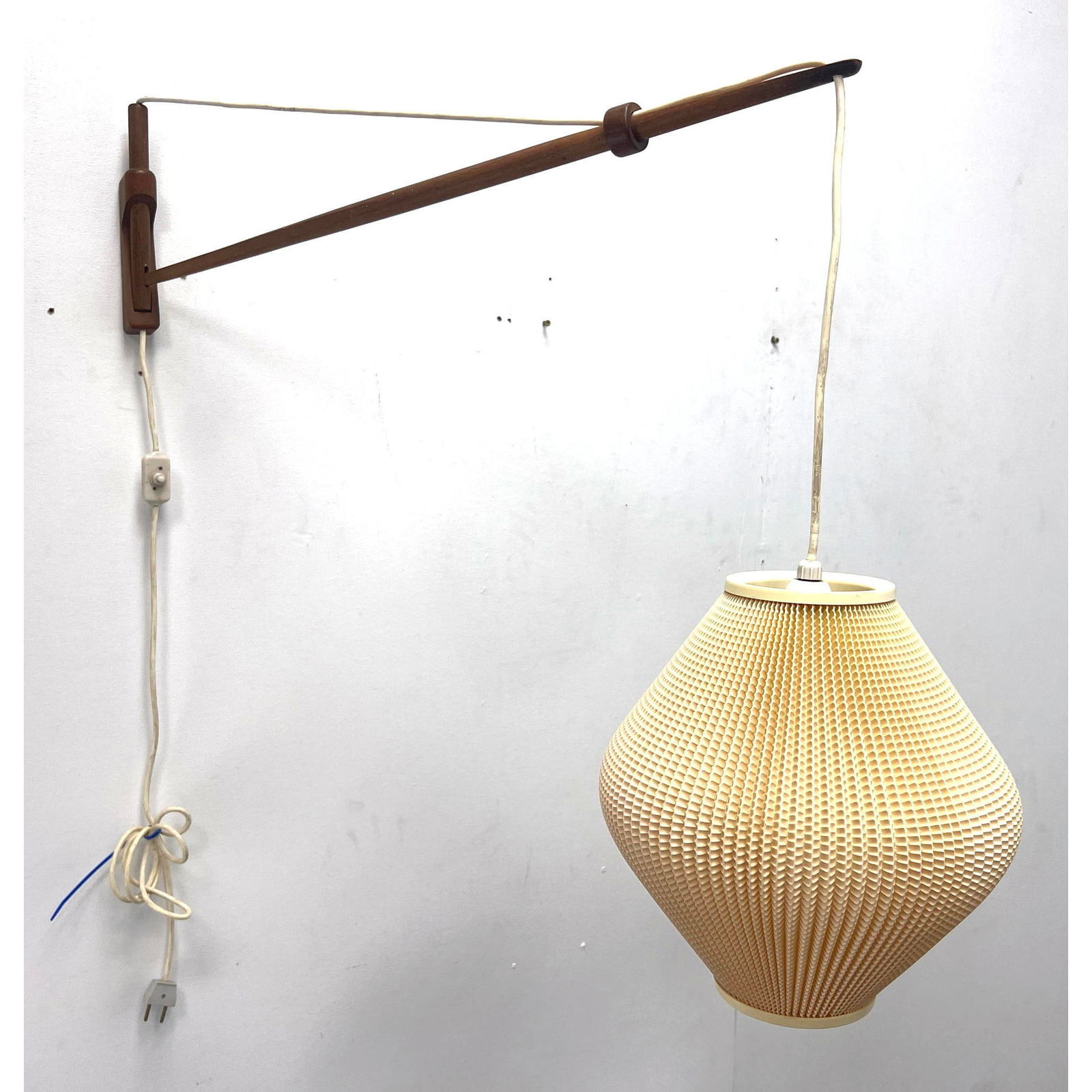 Teak Wall lamp by A. Bank Jensen and Kjeld Iversen for Louis Poulsen. Unsigned.: Teak Wall lamp by A. Bank Jensen and Kjeld Iversen for Louis Poulsen. Unsigned. Dimensions: Height: 26 inches, Width: 31 inches, Depth: 10 inches. --- - We offer curbside delivery for most items to NY