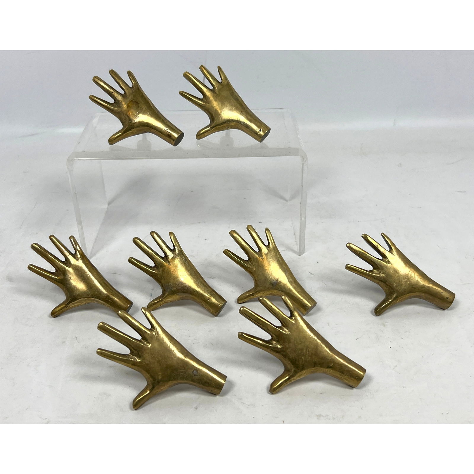 Set 8 Solid Brass Hand Form Pulls. In the style of Carl Aubock.: Set 8 Solid Brass Hand Form Pulls. In the style of Carl Aubock. Dimensions: Height: 3.5 inches, Width: 2.5 inches. --- US Packing and Shipping charge: $35 Plus required insurance at a rate of $2 per h