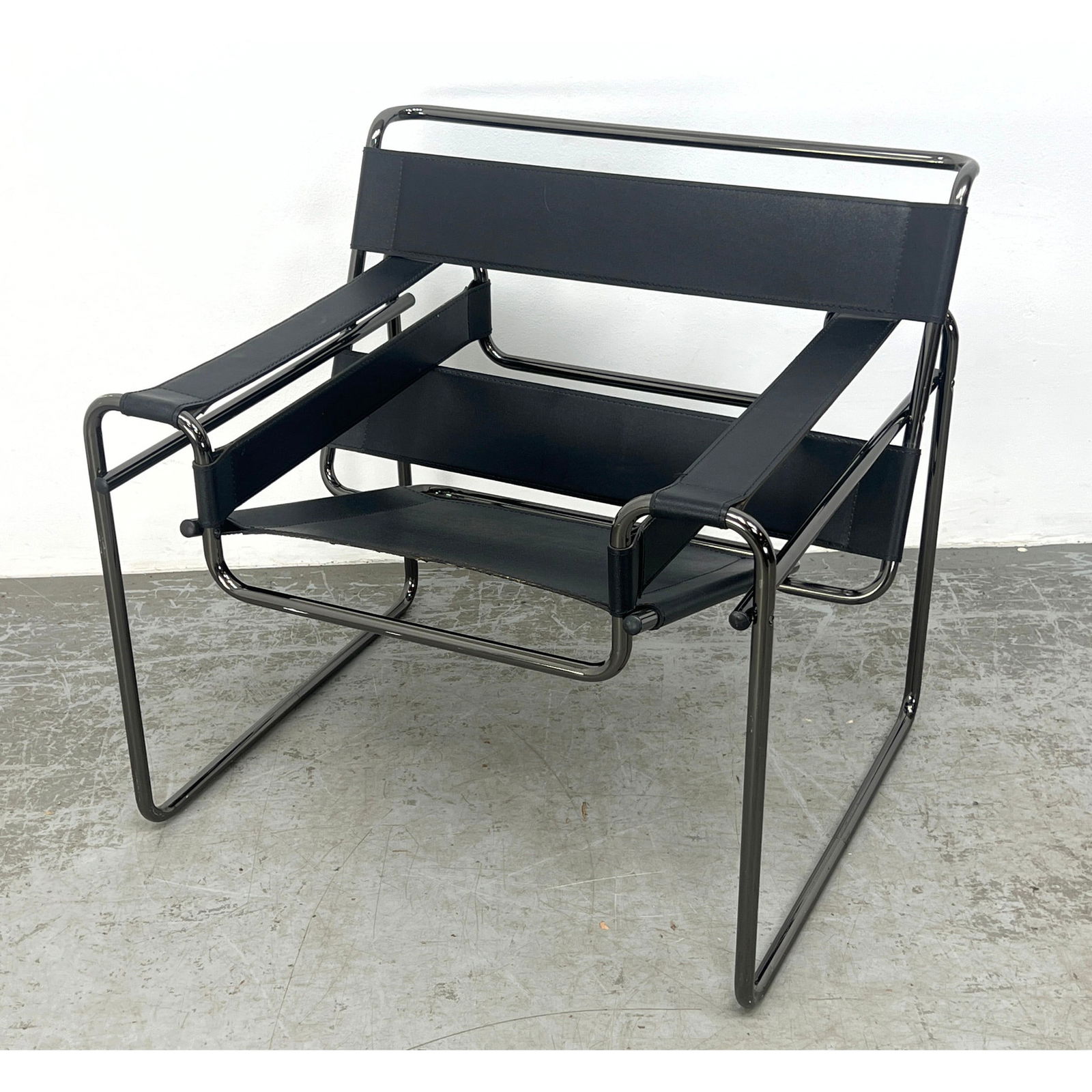 After Marcel Breuer Wassily Lounge Chair. Black straps.: After Marcel Breuer Wassily Lounge Chair. Black straps. Dimensions: Height: 29 inches, Width: 31 inches, Depth: 26.5 inches. - Seat Height: 17 inches --- - We offer curbside delivery for most items to