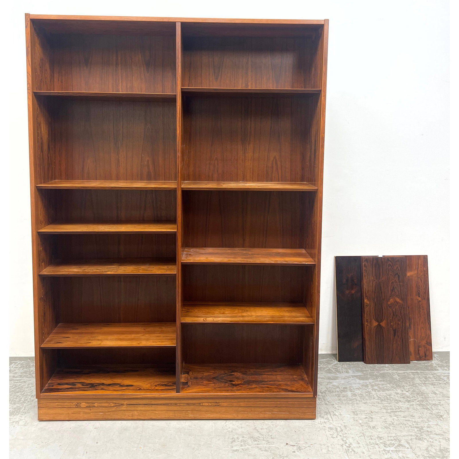 Danish Modern Rosewood Bookcase. Shelves beveled edge.: Danish Modern Rosewood Bookcase. Shelves beveled edge. Dimensions: Height: 77 inches, Width: 54.5 inches, Depth: 12 inches. --- - We offer curbside delivery for most items to NYC, Manhattan, Close Bro