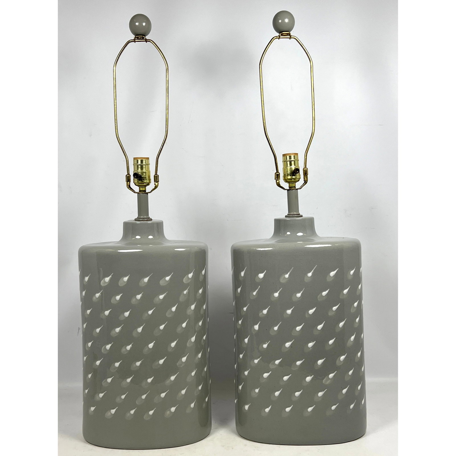 Pair Gray and white Porcelain Table Lamps. Canister shape.: Pair Gray and white Porcelain Table Lamps. Canister shape. Dimensions: Height: 33 inches, Width: 10 inches, Depth: 6 inches. --- - We offer curbside delivery for most items to NYC, Manhattan, Close Br