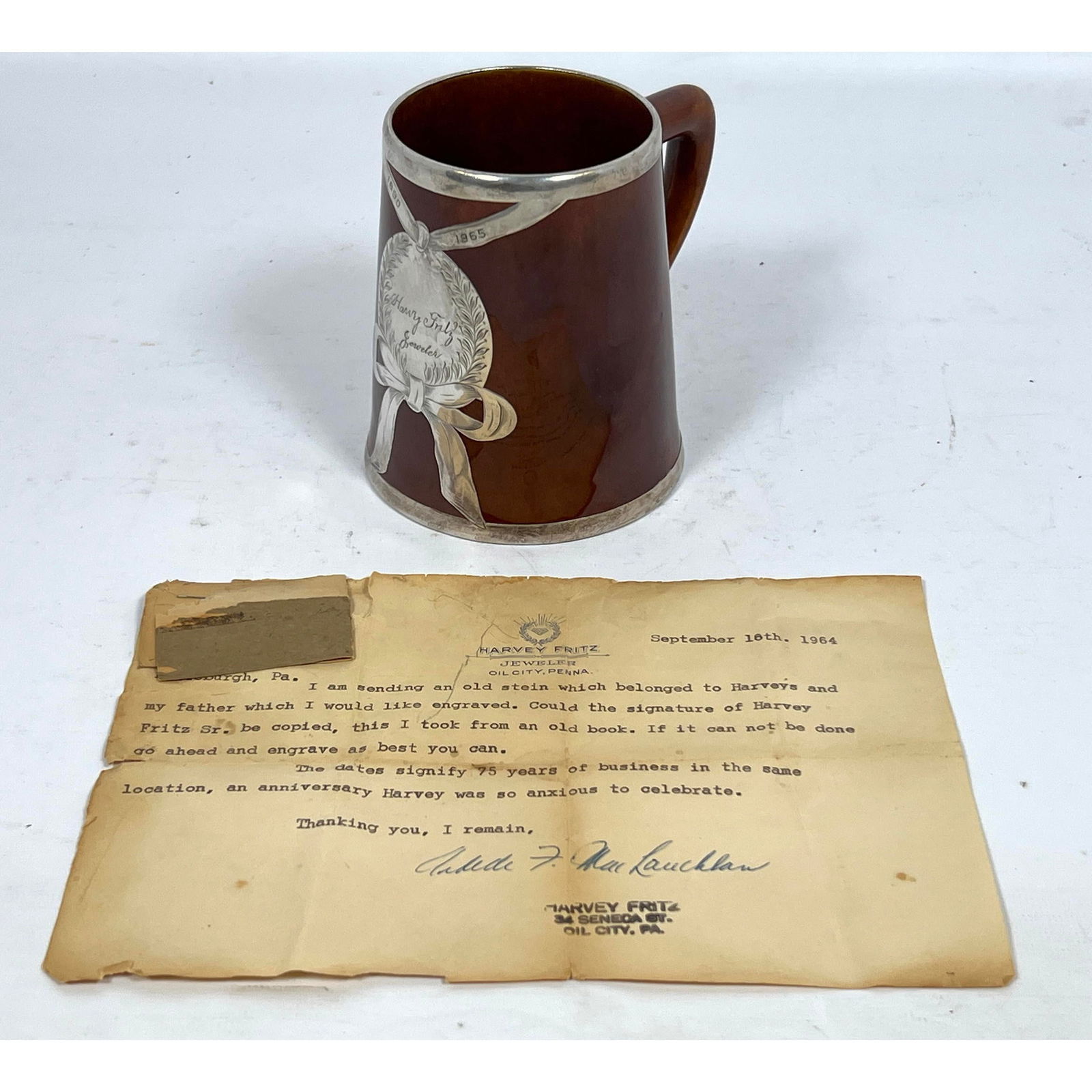 Lenox Sterling Overlay Mug with engraving for Harvey Fritz Jeweler. 1890-1965: Lenox Sterling Overlay Mug with engraving for Harvey Fritz Jeweler. 1890-1965 Dimensions: Height: 4.25 inches, Width: 4.75 inches, Depth: 3.75 inches. --- US Packing and Shipping charge: In house ship