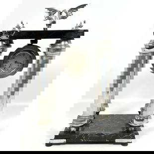Italian 4 Column Mantle Clock suspended between Pillar Form Base. Spread Wing Eagle Finial. Black Ma: Italian 4 Column Mantle Clock suspended between Pillar Form Base. Spread Wing Eagle Finial. Black Marble. Clock marked Italy. Dimensions: Height: 14 inches, Width: 8 inches, Depth: 6 inches. --- US Pa