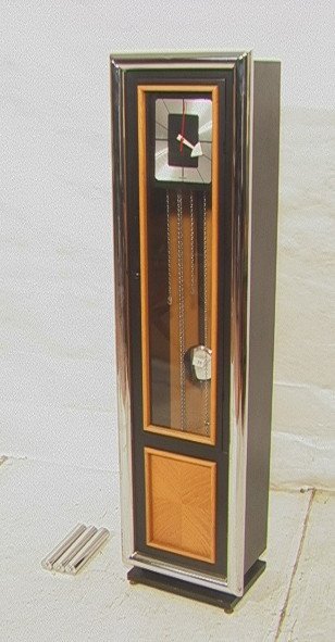 Nelson Howard Miller Tall Case Clock. Grandfathe: Nelson Howard Miller Tall Case Clock. Grandfathers clock. Black case with thick chrome tube frame. Oak Panel.-- Dimensions: H: 64 inches: W: 16 inches: D: 10 inches ---