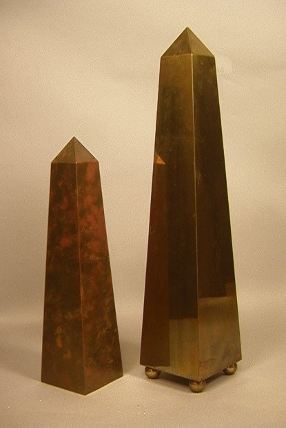 2pc Tall Brass Obelisks. MAITLAND SMITH tag on ta: 2pc Tall Brass Obelisks. MAITLAND SMITH tag on taller piece with brass ball feet. 2 PCS -- Dimensions: H: 21 inches: W: 4.5 inches ---