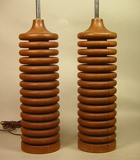 Pr LAUREL Modernist Solid Teak Table Lamps. Two l: Pr LAUREL Modernist Solid Teak Table Lamps. Two lamps of stacked teak ring construction.-- Dimensions: H: 28 inches: W: 6 inches ---