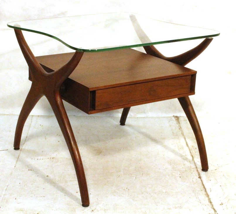 Glass Top Adrian Pearsall Side Table. Corseted Wo: Glass Top Adrian Pearsall Side Table. Corseted Wood sides support one drawer and shaped glass top. Unmarked.-- Dimensions: H: 22.75 inches: W: 26 inches: D: 26.25 inches ---