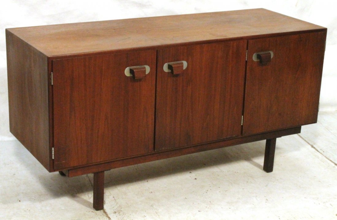 JENS RISOM Three Door Teak Credenza Sideboard. Wo: JENS RISOM Three Door Teak Credenza Sideboard. Wood pulls with metal back. JR Label taped to inside. -- Dimensions: H: 28 inches: D: 20.5 inches: L: 54.25 inches ---