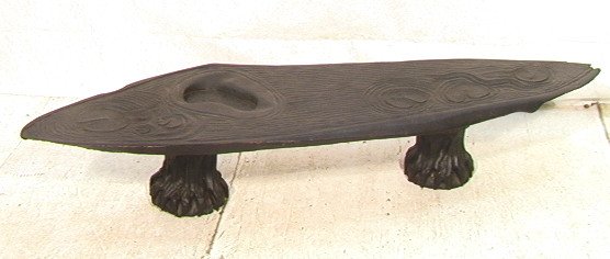 Natural form Carved Wood Coffee Table. Carved Lil: Natural form Carved Wood Coffee Table. Carved Lily Pad top on trunk base. Initialed RK.-- Dimensions: H: 12 inches: D: 20 inches: L: 70 inches ---
