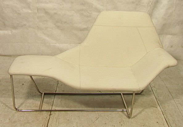 Contemporary Chaise Lounge. Cream Leather Upholst: Contemporary Chaise Lounge. Cream Leather Upholstery. Tubular Chrome Legs. Unmarked.-- Dimensions: H: 39 inches: D: 22 inches: L: 66 inches ---