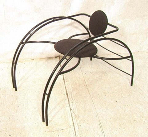 Memphis Style Black Metal Spider Chair. Black Fab: Memphis Style Black Metal Spider Chair. Black Fabric upholstered seat and back. -- Dimensions: H: 27 inches: W: 26 inches: D: 39 inches ---