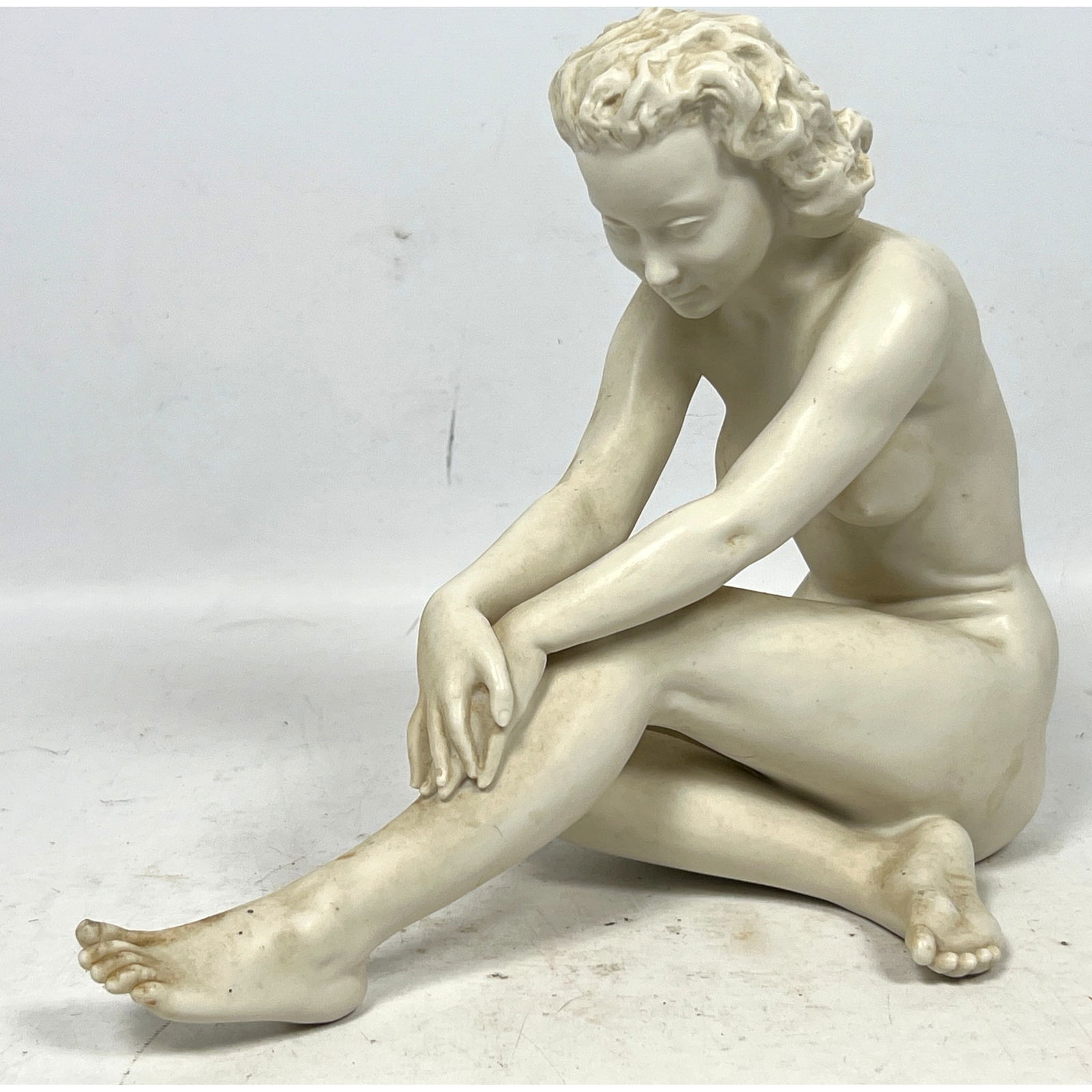 Hutschenreuther bisque porcelain figure Sculpture. Seated Nude. Carl Werner: Hutschenreuther bisque porcelain figure Sculpture. Seated Nude. Carl Werner Dimensions: Height: 9 inches, Width: 11 inches, Depth: 6 inches. --- US Packing and Shipping charge: In house shipping avail
