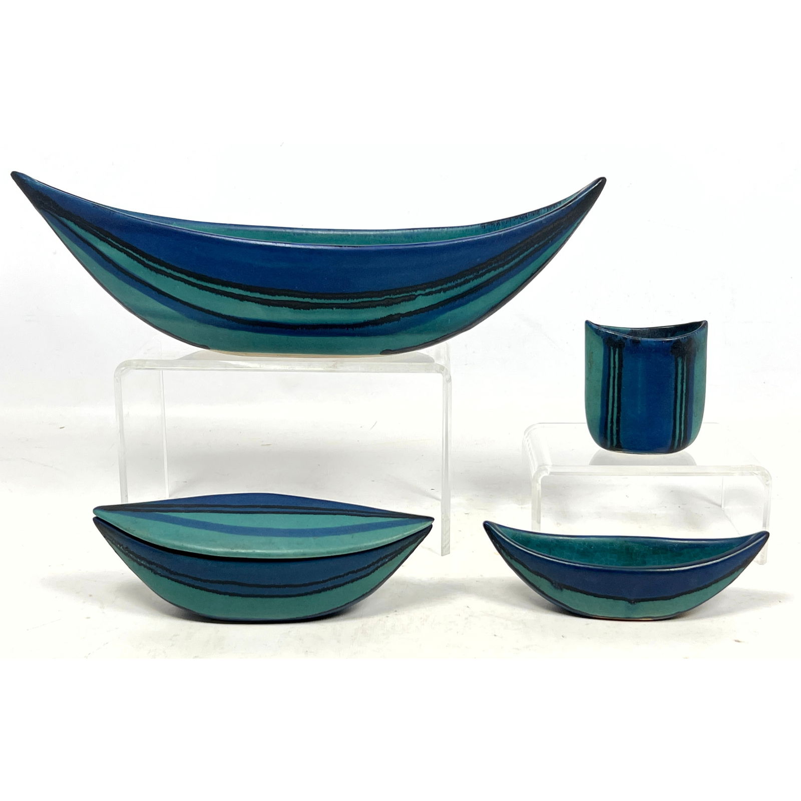 4pcs Fong Chow Glidden Studio Pottery Gulfstream. Large boat shaped console bowl, two smaller boat s: 4pcs Fong Chow Glidden Studio Pottery Gulfstream. Large boat shaped console bowl, two smaller boat shapes and lidded match stick holder, Signed Dimensions: Height: 4 inches, Width: 14 inches, Depth: 4