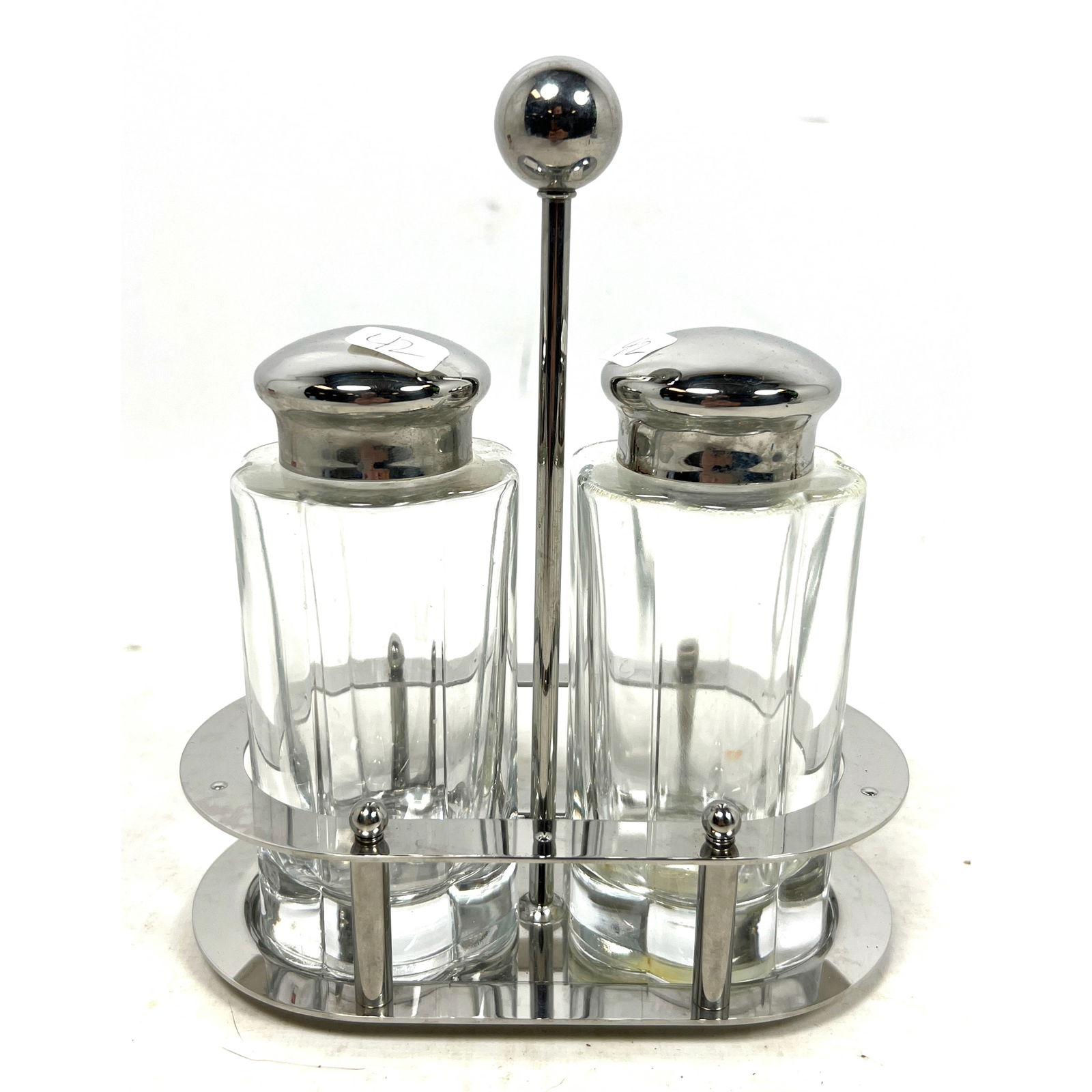 Alessi Michael Graves Oil and Vinegar 1994 MG04 Oil and vinegar Lead crystal and stainless steel: Alessi Michael Graves Oil and Vinegar 1994 MG04 Oil and vinegar Lead crystal and stainless steel Dimensions: Height: 8 inches, Width: 7 inches, Depth: 3.75 inches. --- US Packing and Shipping charge: