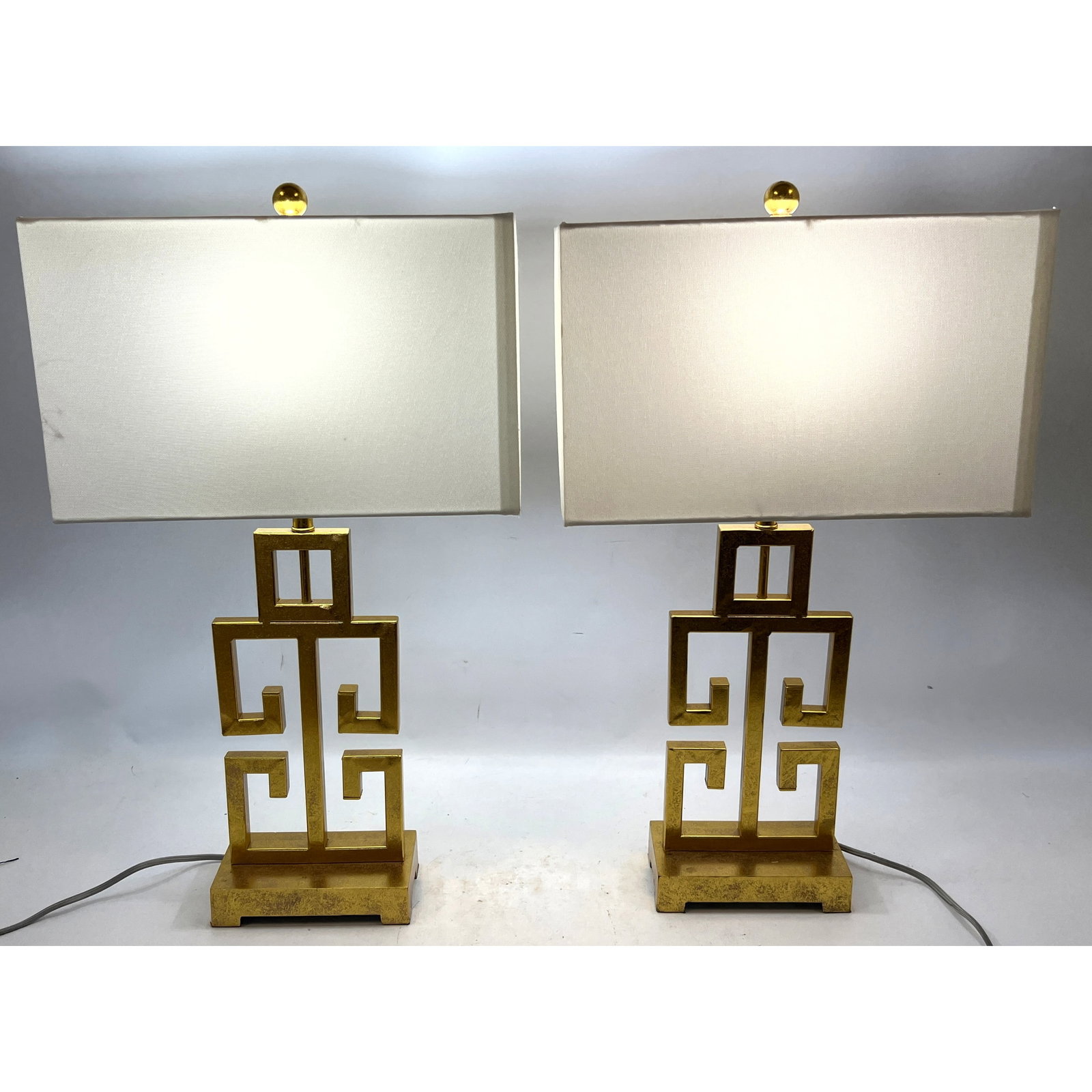 Pair Safavieh Table Lamps. Gilt Metal.: Pair Safavieh Table Lamps. Gilt Metal. Dimensions: Height: 28 inches, Width: 16 inches, Depth: 9 inches. --- - We offer curbside delivery for most items to NYC, Manhattan, Close Brooklyn, Hoboken abou
