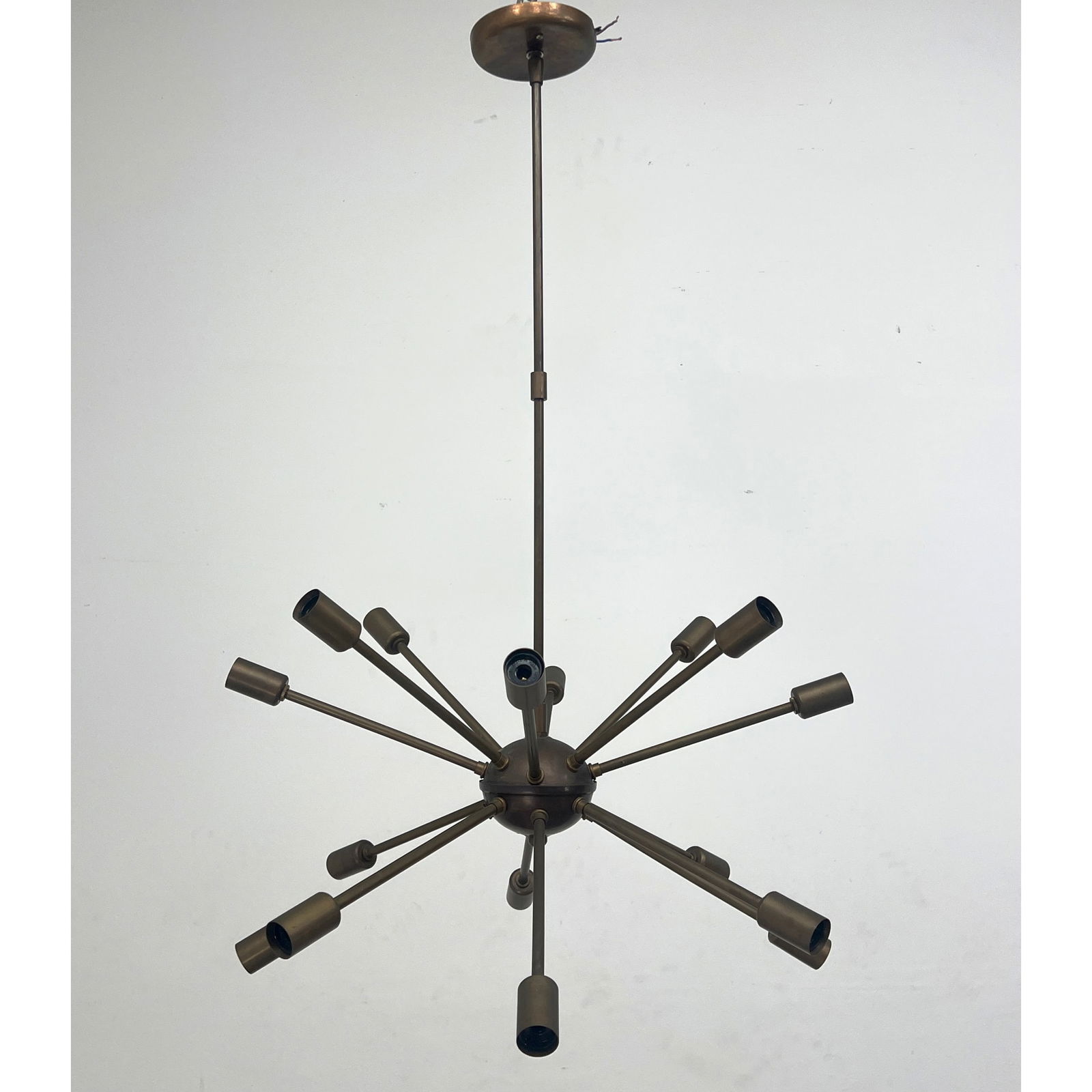 Modernist Sputnik Hanging Chandelier. 16 arms with bulb sockets. Dark bronze finish.: Modernist Sputnik Hanging Chandelier. 16 arms with bulb sockets. Dark bronze finish. Dimensions: Height: 32 inches, Width: 24 inches, Depth: 24 inches. --- - We offer curbside delivery for most items