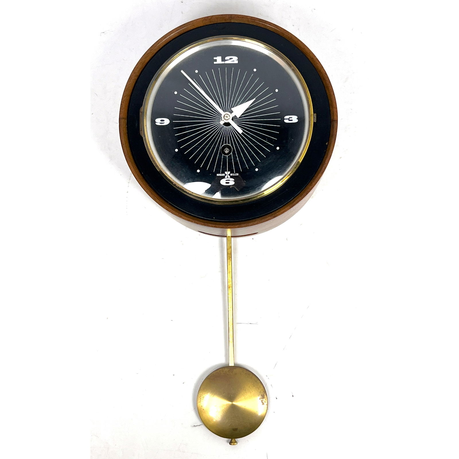 Arthur Umanoff Howard Miller wind Up Pendulum Wall Clock.: Arthur Umanoff Howard Miller wind Up Pendulum Wall Clock. Dimensions: Height: 16 inches, Width: 8 inches, Depth: 3.5 inches. --- US Packing and Shipping charge: In house shipping available. Will be ca