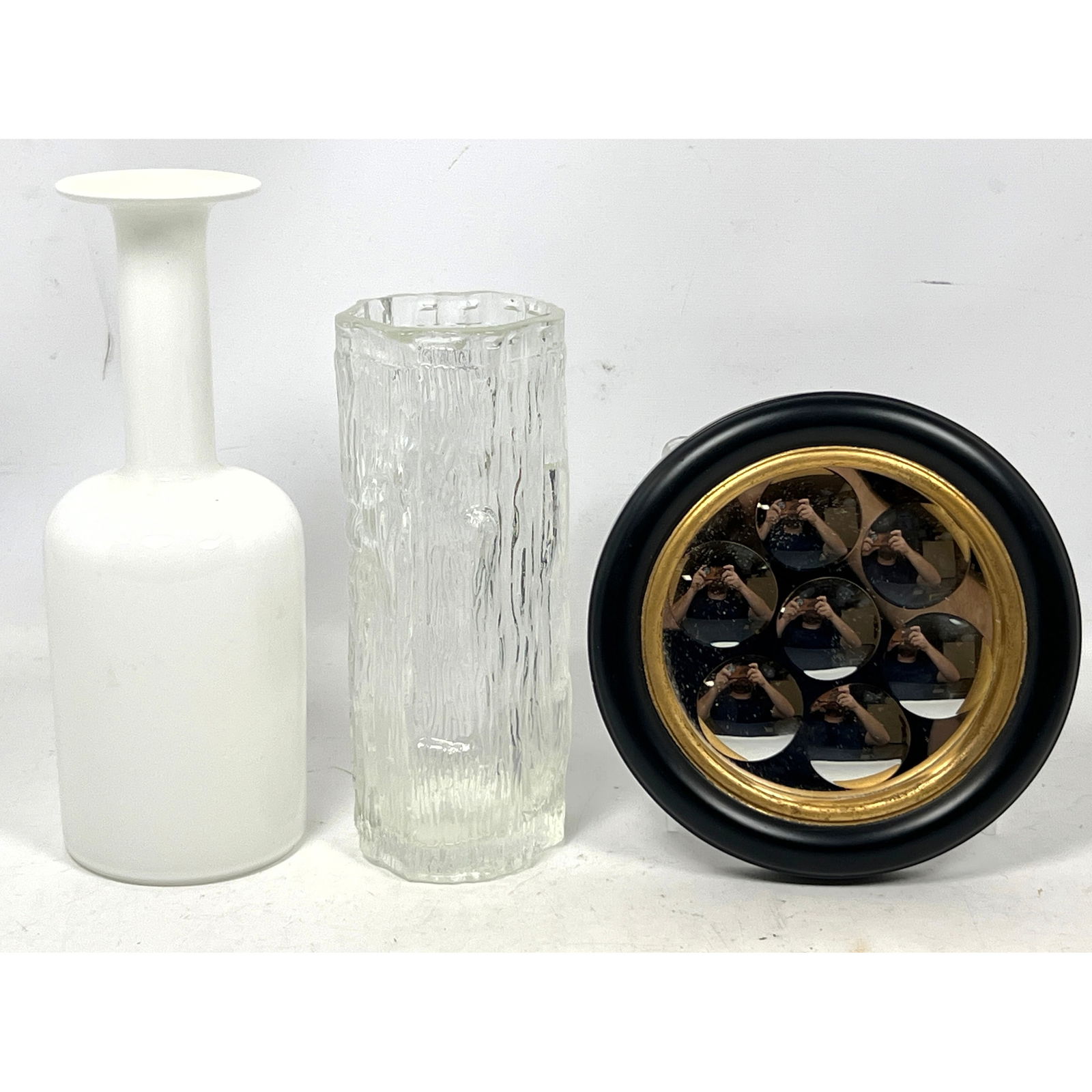 3pcs Decorative Objects. Small Fornasetti style Dimpled Mirror, Holmegaard Otto Brauer Bottle Vase,: 3pcs Decorative Objects. Small Fornasetti style Dimpled Mirror, Holmegaard Otto Brauer Bottle Vase, Wirkkala Style Vase. Dimensions: Height: 10 inches, Width: 4 inches, Depth: 4 inches. --- US Packing