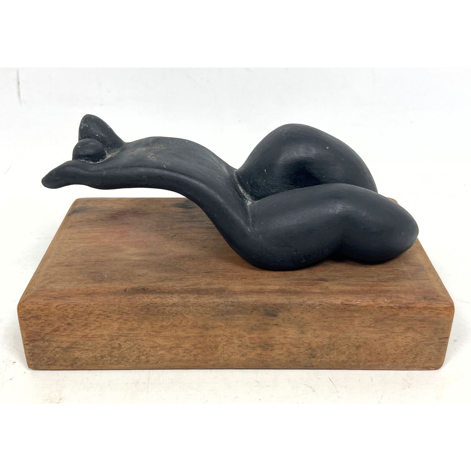 N SANTAELLA Modernist Abstract Nude Sculpture. Reclining Form. Inspired by Henry Moore forms. Wood B: N SANTAELLA Modernist Abstract Nude Sculpture. Reclining Form. Inspired by Henry Moore forms. Wood Base. Sculpture Signed. Brass Name Plaque. Dimensions: Height: 4 inches, Width: 4.75 inches, Depth: 8
