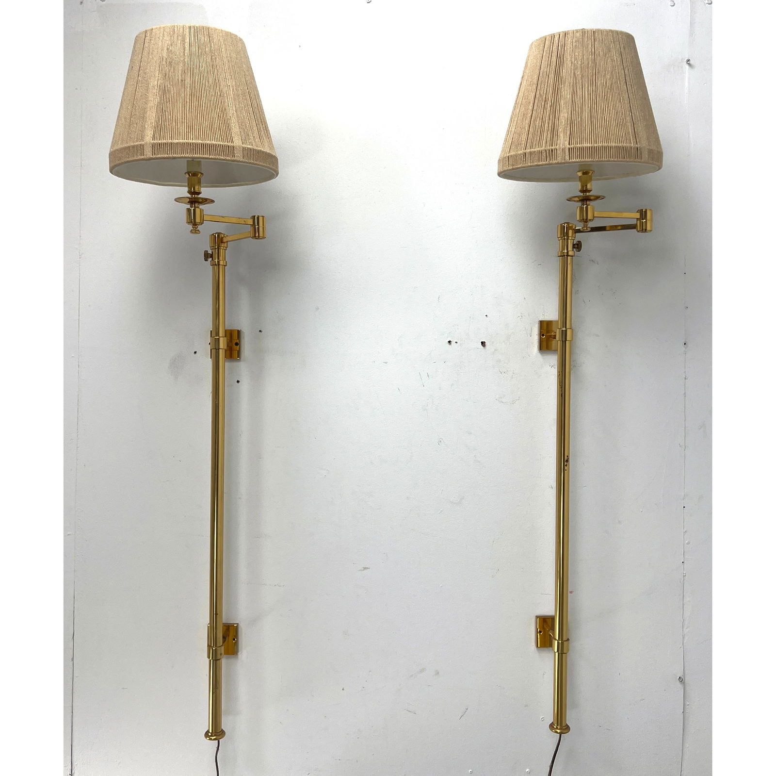 Pair of Tall Hansen brass swing arm wall sconces These wall-mounted lamps are constructed primarily (1 of 15)