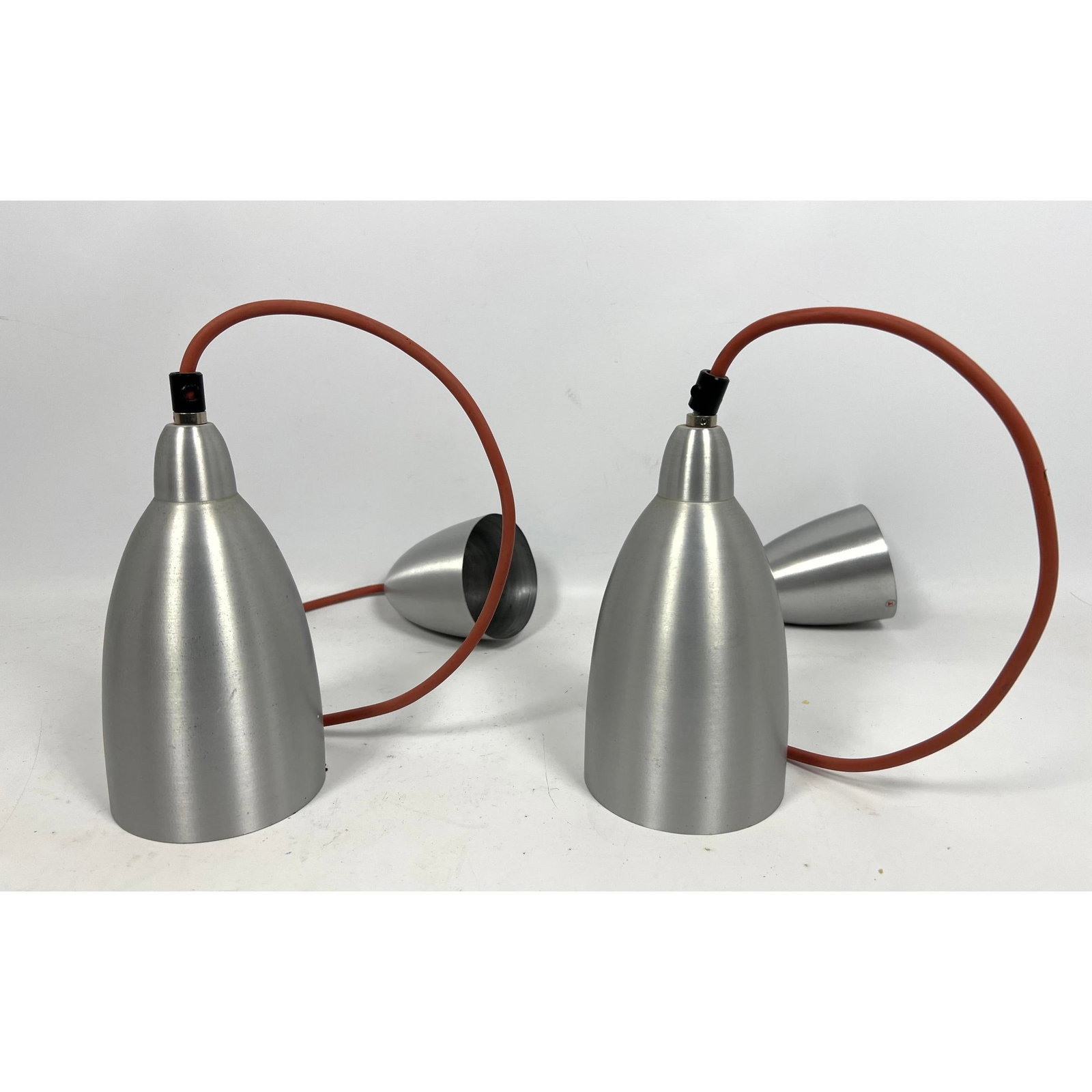 Pair Spun Aluminum pendant lamps by Dijkstra, Netherlands: Pair Spun Aluminum pendant lamps by Dijkstra, Netherlands Dimensions: Height: 45 inches, Width: 4.5 inches, Depth: 4.5 inches. --- US Packing and Shipping charge: In house shipping available. Will be 