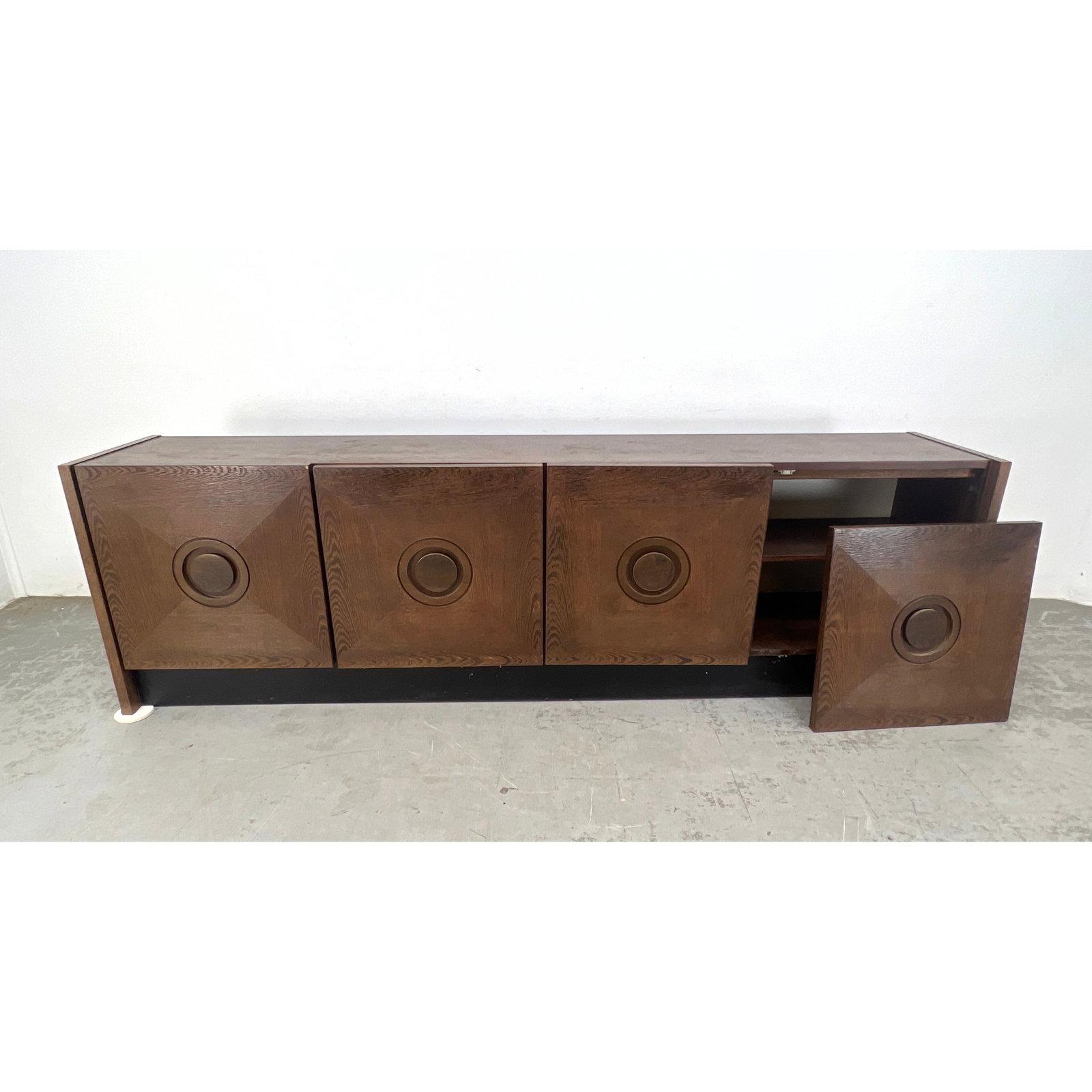 MCM Belgium Wenge Sideboard. Four doors with faceted design and center medallion motif. Platform Bas: MCM Belgium Wenge Sideboard. Four doors with faceted design and center medallion motif. Platform Base. Dimensions: Height: 29.5 inches, Width: 98.5 inches, Depth: 18 inches. --- - We offer curbside de
