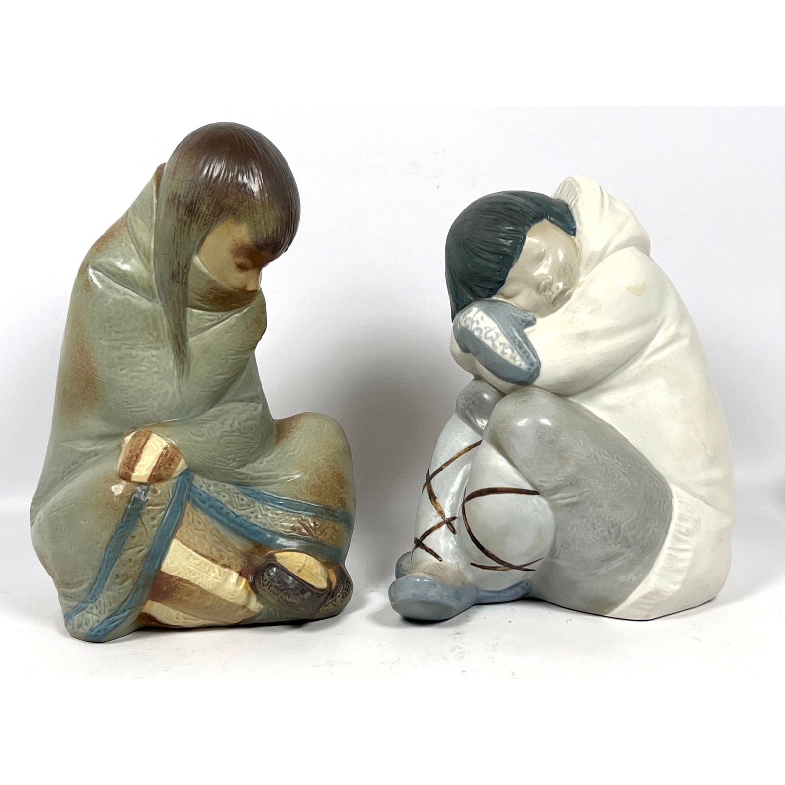 2pcs Lladro porcelain figurines, titled 'Eskimo Slumber' and 'Eskimo Nap. Sculptures. (1 of 12)