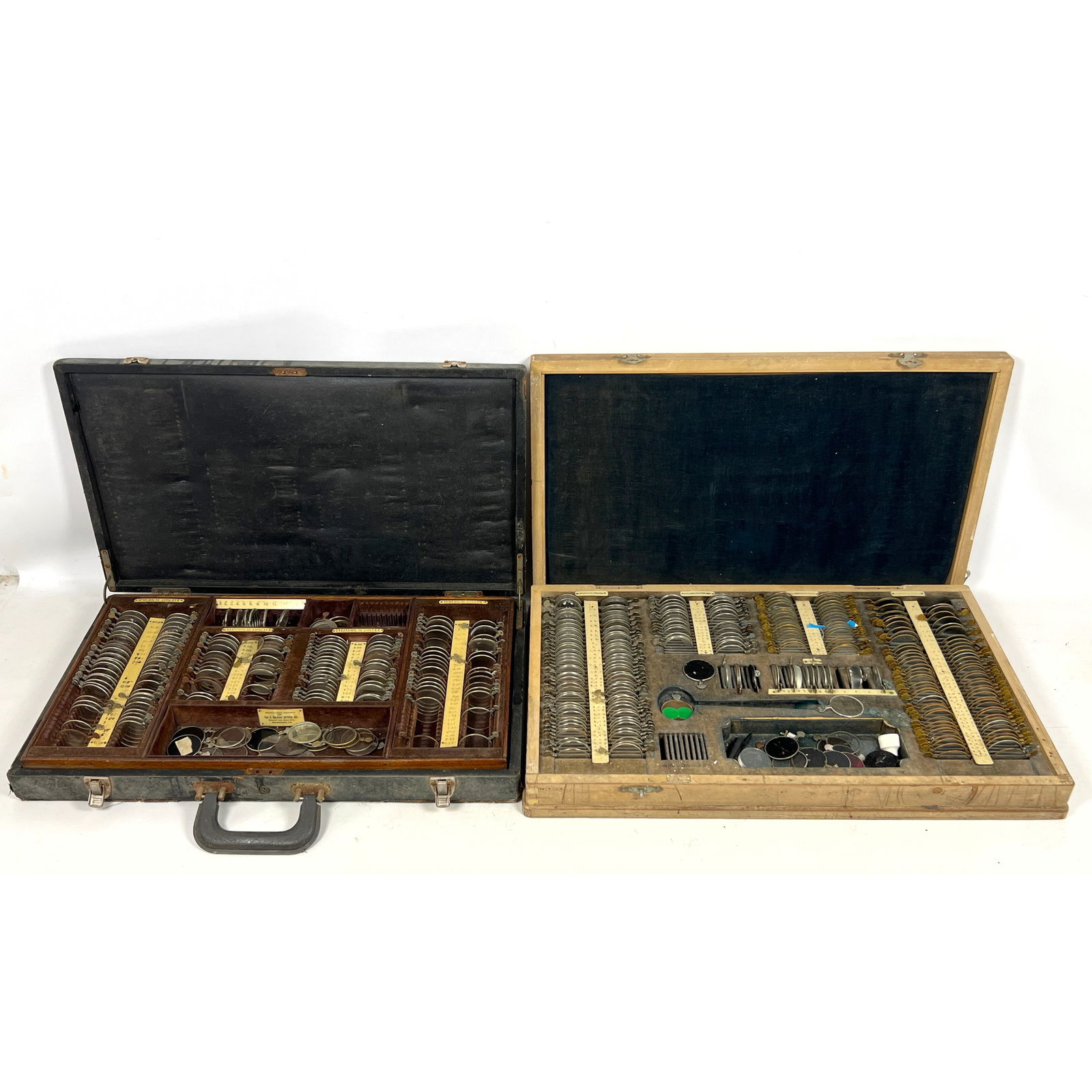 2 Cases antique optometrist's trial lens sets, comprising one set housed in a dark, likely leatheret (1 of 15)