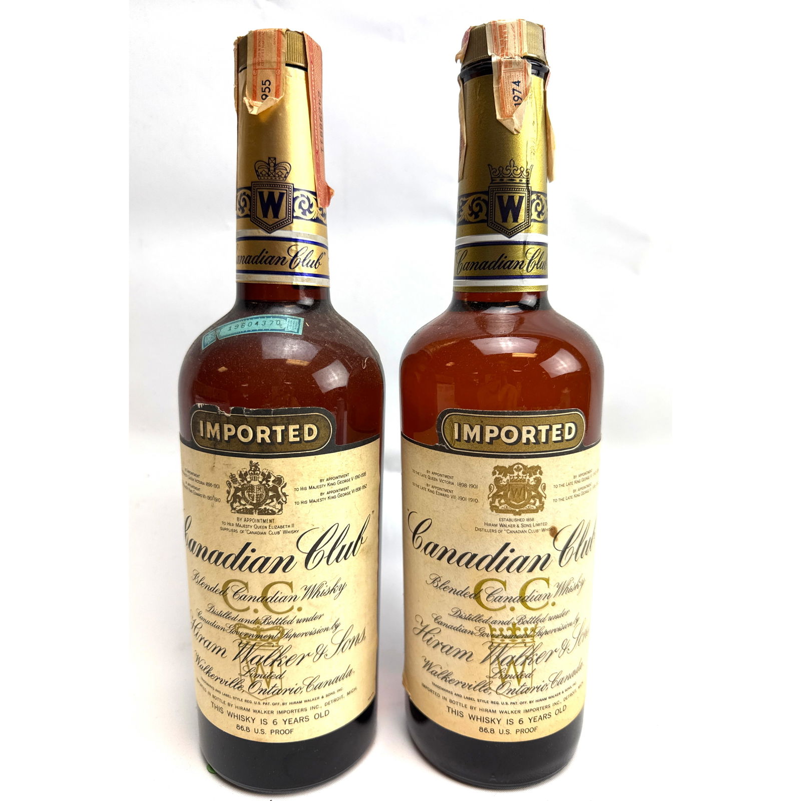 2pc 1955 and 1974 bottles Canadian Club blended whisky.: 2pc 1955 and 1974 bottles Canadian Club blended whisky. Dimensions: Height: 12 inches, Width: 3 inches, Depth: 3 inches. --- - We offer curbside delivery for most items to NYC, Manhattan, Close Brookl