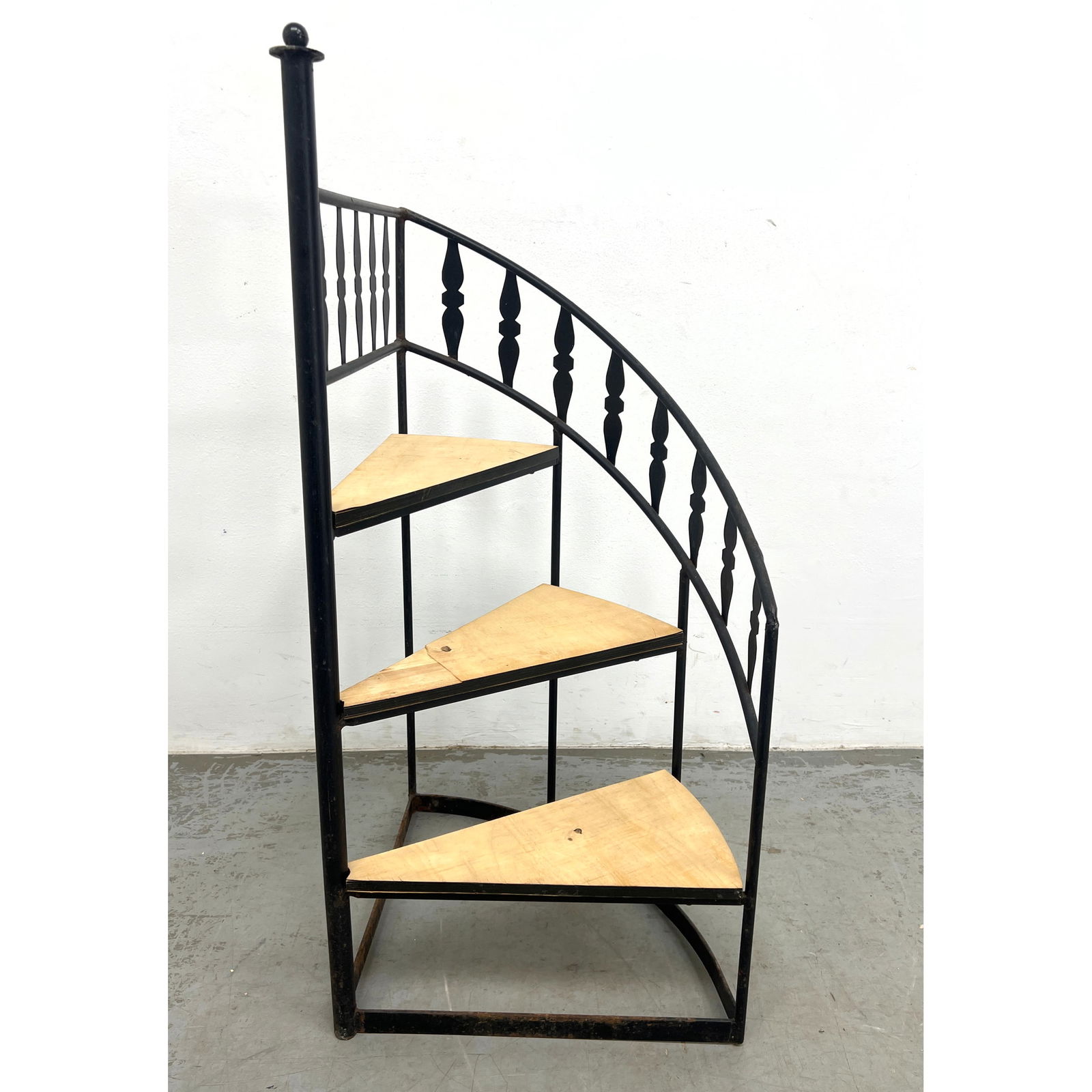 ARTHUR UMANOFF For Shaver Howard Spiral Staircase Display Stand. Iron Frame with Three Triangular Le: ARTHUR UMANOFF For Shaver Howard Spiral Staircase Display Stand. Iron Frame with Three Triangular Levels Tiers. Decorative Iron Rail. Dimensions: Height: 41 inches, Width: 19 inches, Depth: 19 inches.
