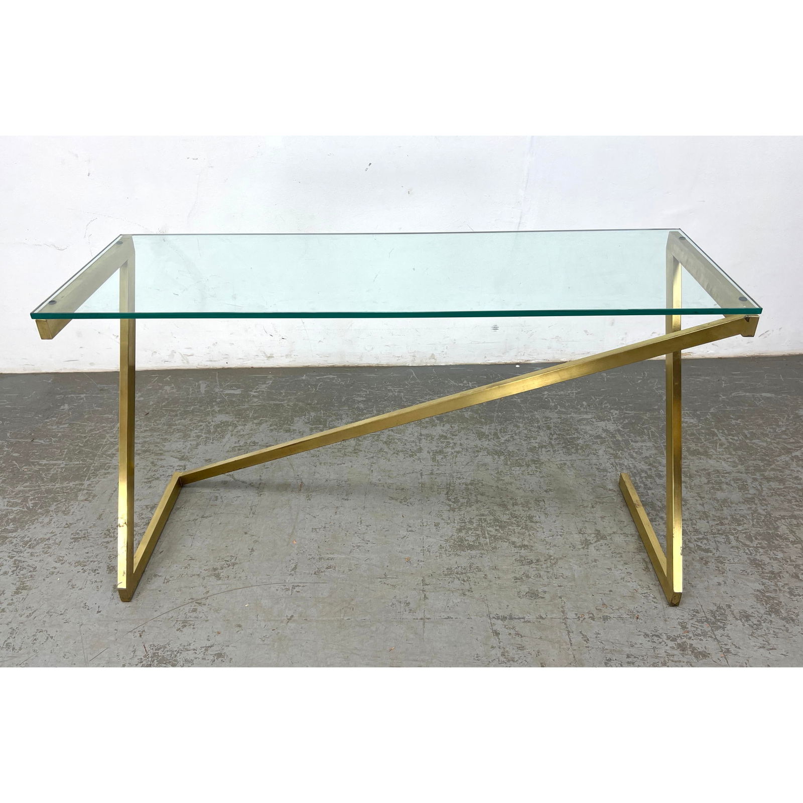 DESIGN INSTITUTE of AMERICA Style Brass and Glass 1970's Console Sofa Table.: DESIGN INSTITUTE of AMERICA Style Brass and Glass 1970's Console Sofa Table. Dimensions: Height: 28.5 inches, Width: 49.5 inches, Depth: 16.5 inches. ---