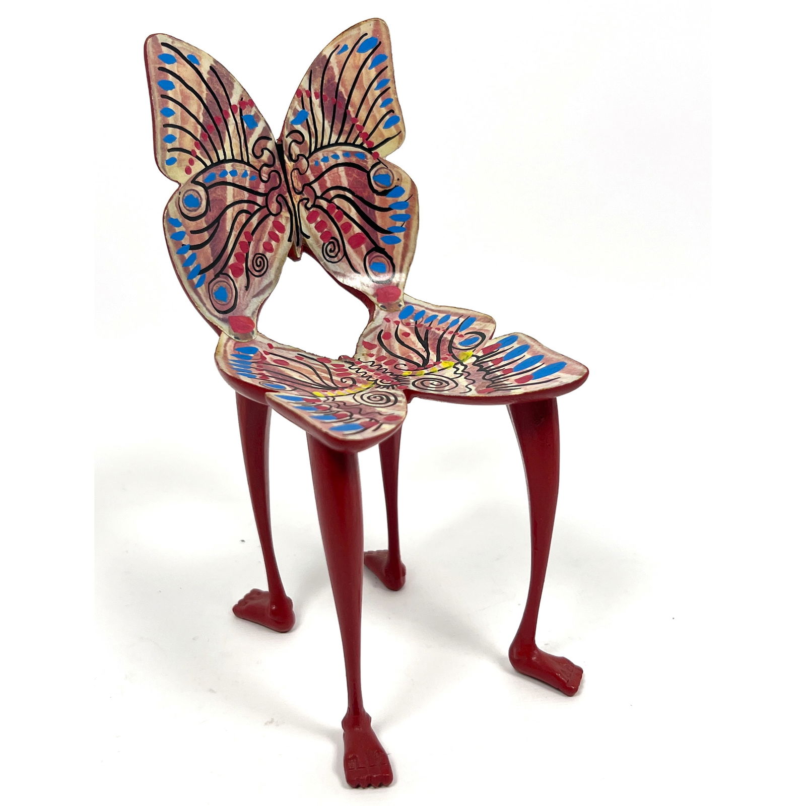 Pedro Friedeberg miniature Butterfly chair sculpture. Polychrome wood. Human feet. Signed.: Pedro Friedeberg miniature Butterfly chair sculpture. Polychrome wood. Human feet. Signed. Dimensions: Height: 7 inches, Width: 3.25 inches, Depth: 4 inches. --- US Packing and Shipping charge: $35 Pl