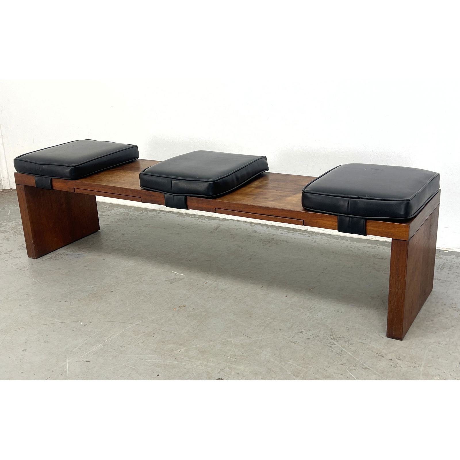 MILO BAUGHMAN for THAYER COGGIN Bench. American Mid Century Modern Walnut Bench Seating. Three Black: MILO BAUGHMAN for THAYER COGGIN Bench. American Mid Century Modern Walnut Bench Seating. Three Black Pillow Seats. Two Pull Out Table Levels. Label. Dimensions: Height: 16.5 inches, Width: 60 inches,