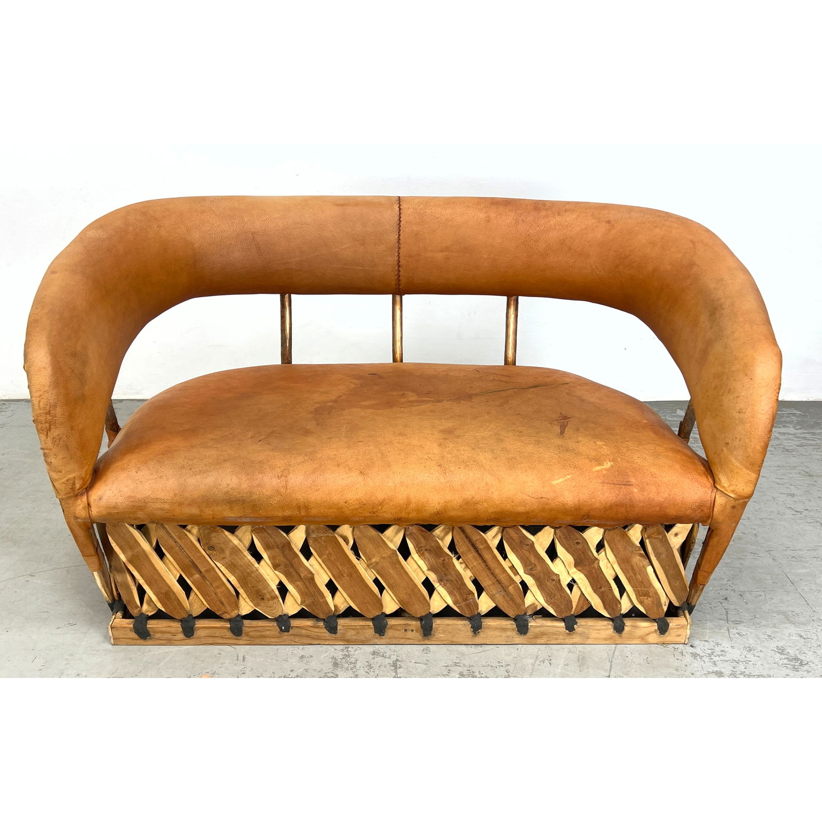 Tan Leather and Wood Mexican Equipale Love Seat. Natural Sliced Wood Frame Base with pencil reed det (1 of 10)