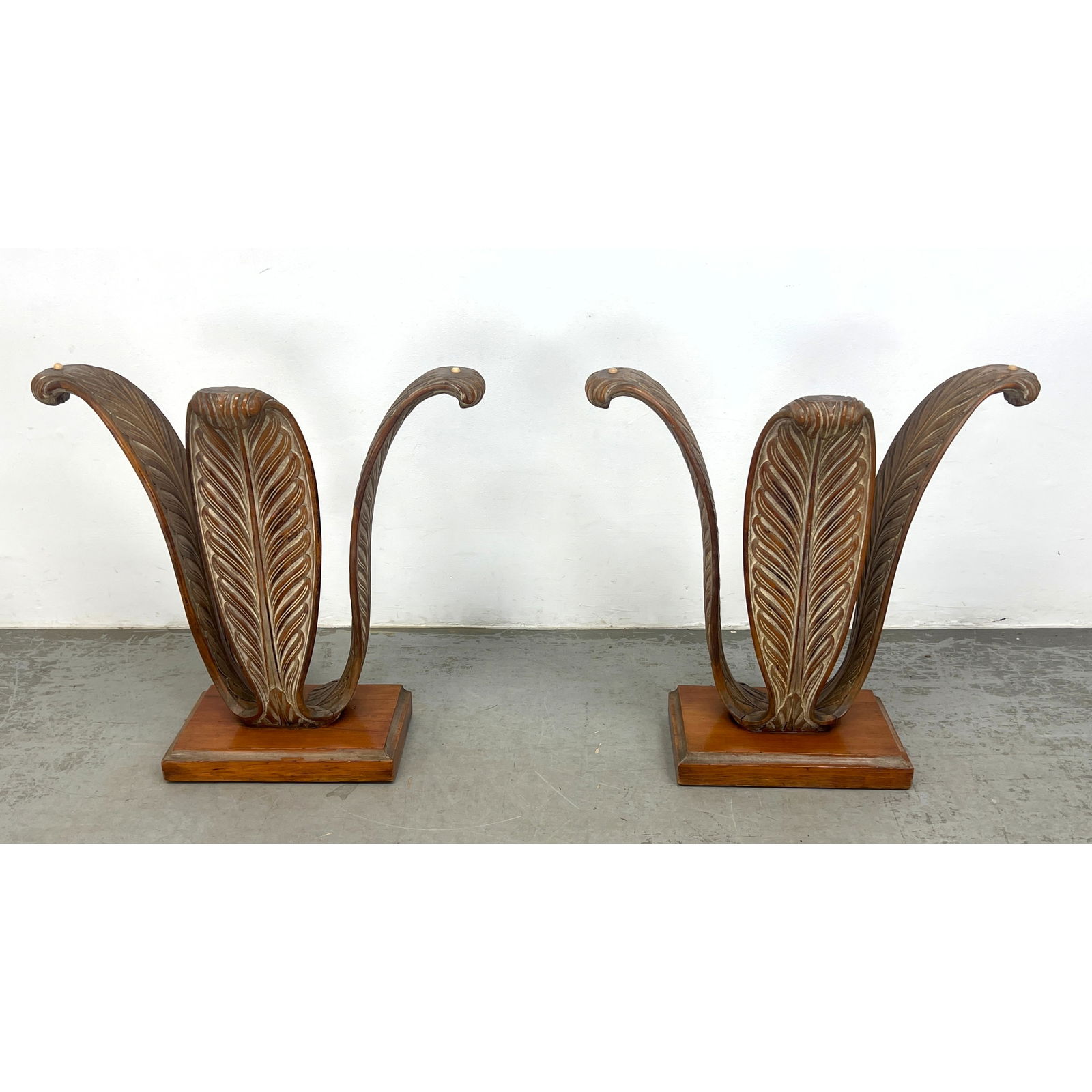 Pr Grosfeld house style Three Leaf Table Bases. Carved Wood Flared Leaf forms on Wood Plinth Base. T: Pr Grosfeld house style Three Leaf Table Bases. Carved Wood Flared Leaf forms on Wood Plinth Base. The two bases could be used for long Console / Hall Table. Or Two Small Console Tables. Presently sol