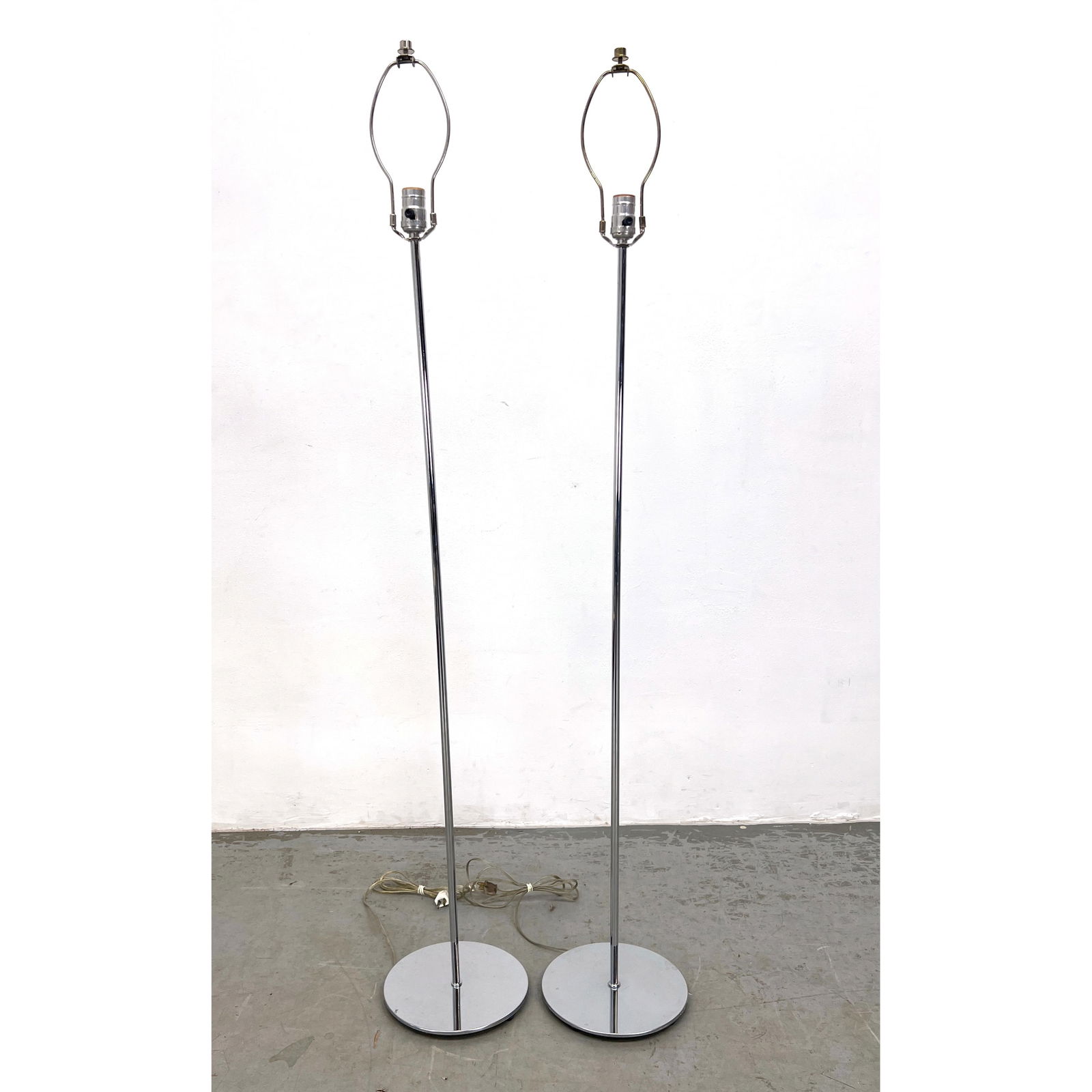 Pair Kovacs Chrome Stick Floor Lamps: Pair Kovacs Chrome Stick Floor Lamps Dimensions: Height: 55 inches, Width: 9 inches, Depth: 9 inches. --- - We offer curbside delivery for most items to NYC, Manhattan, Close Brooklyn, Hoboken about a