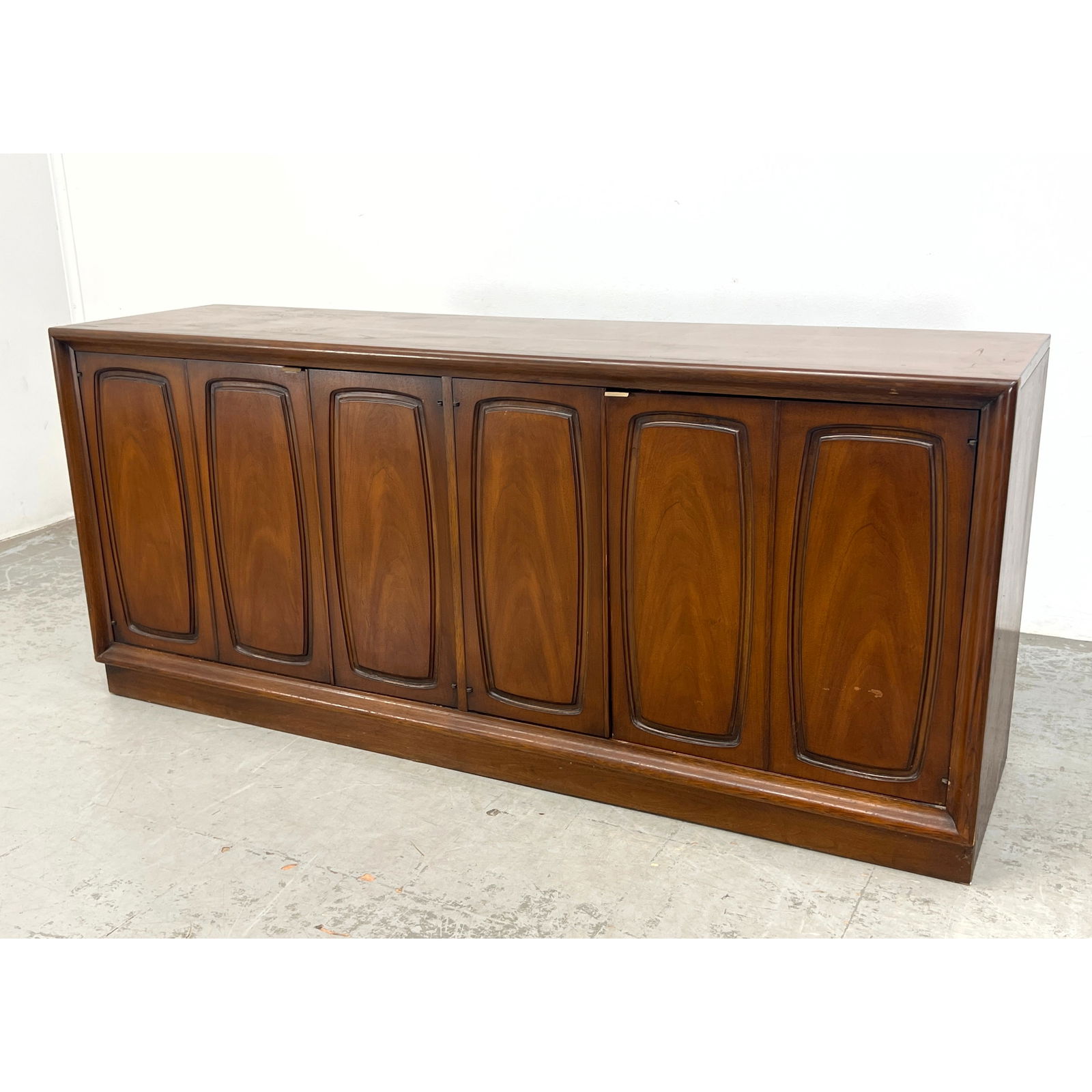 MCM Mid Century BROYHILL Credenza. Sideboard. American Modern Walnut Cabinet has shaped panel doors. (1 of 11)