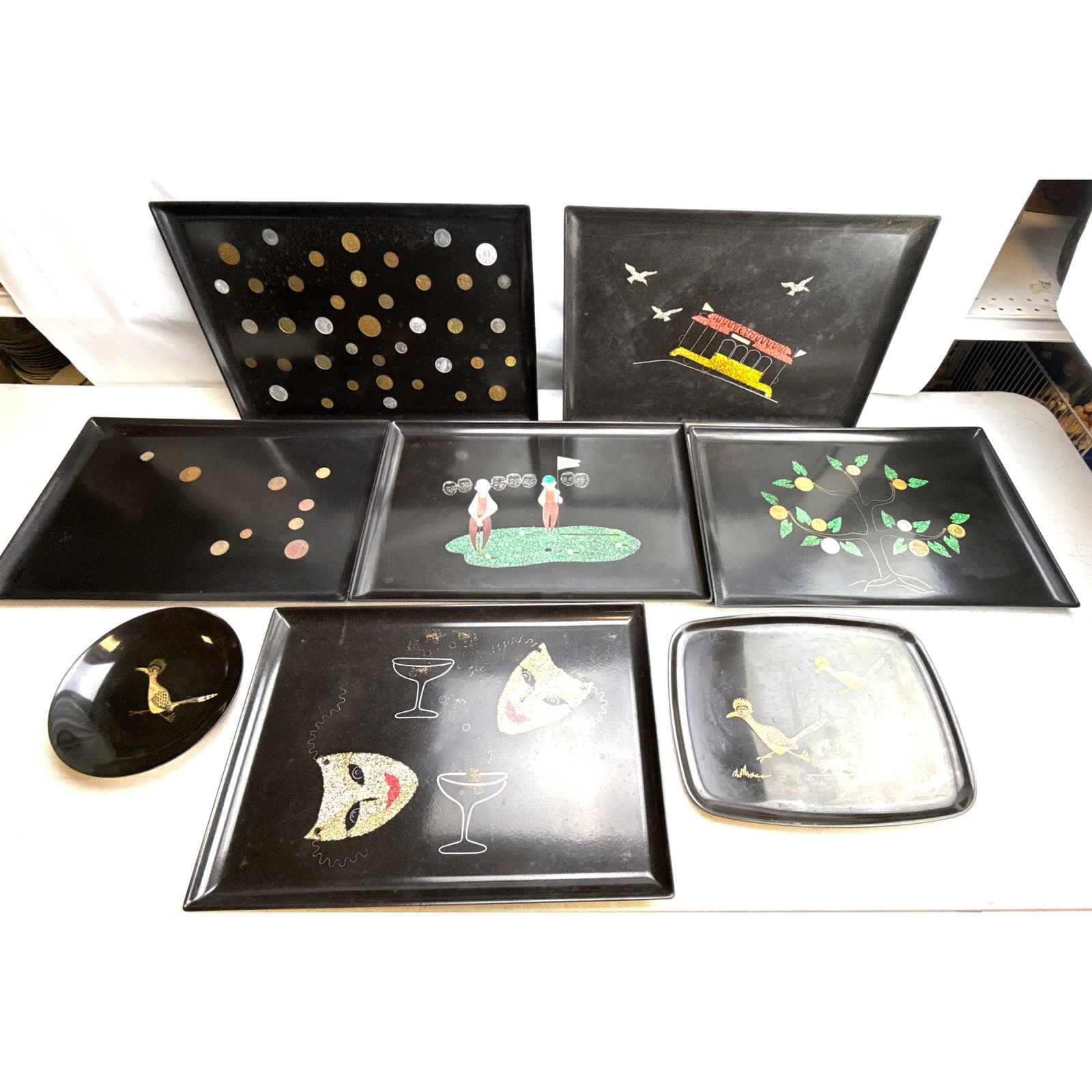 8 COUROC Trays, Bowl. Themes include Golfers, Masks and Martinis, Coins, Money Growing on Trees, Roa (1 of 12)