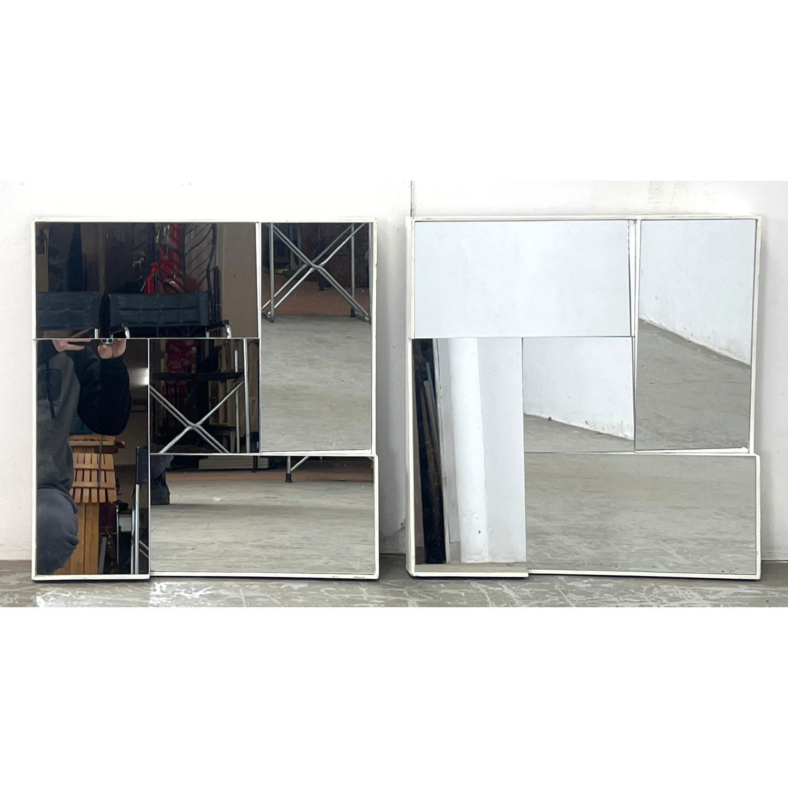 Pair wall mirrors in the manner of Neal Small iconic Slopes series. White painted edges.: Pair wall mirrors in the manner of Neal Small iconic Slopes series. White painted edges. Dimensions: Height: 20 inches, Width: 20 inches. --- - We offer curbside delivery for most items to NYC, Manhat