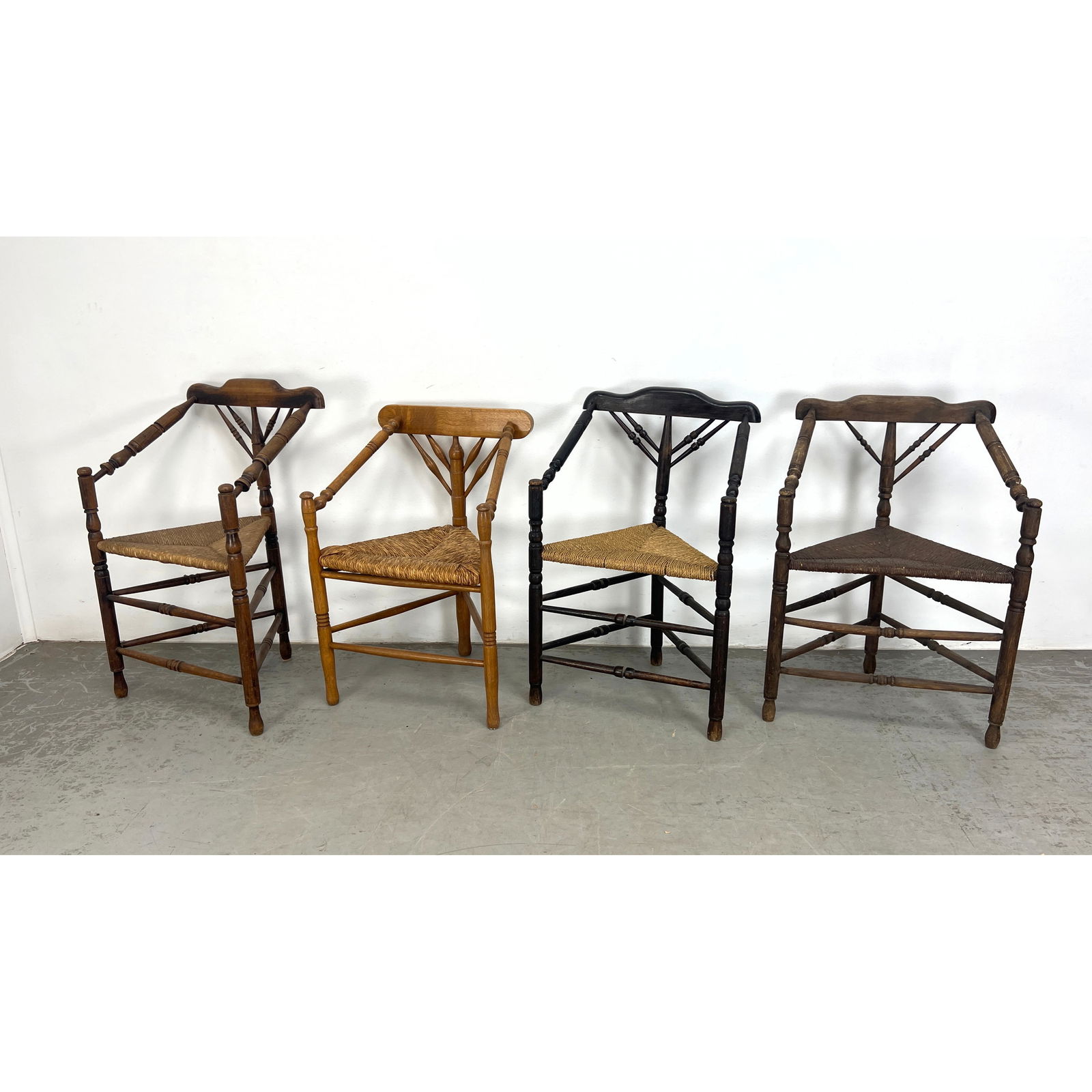 4pcs Continental Triangular Corner Chairs. Triangular Rush Seats. Three Leg Chairs with double row o: 4pcs Continental Triangular Corner Chairs. Triangular Rush Seats. Three Leg Chairs with double row of spindle stretchers. Likely French or Dutch Dimensions: Height: 32.5 inches, Width: 23 inches, Dept