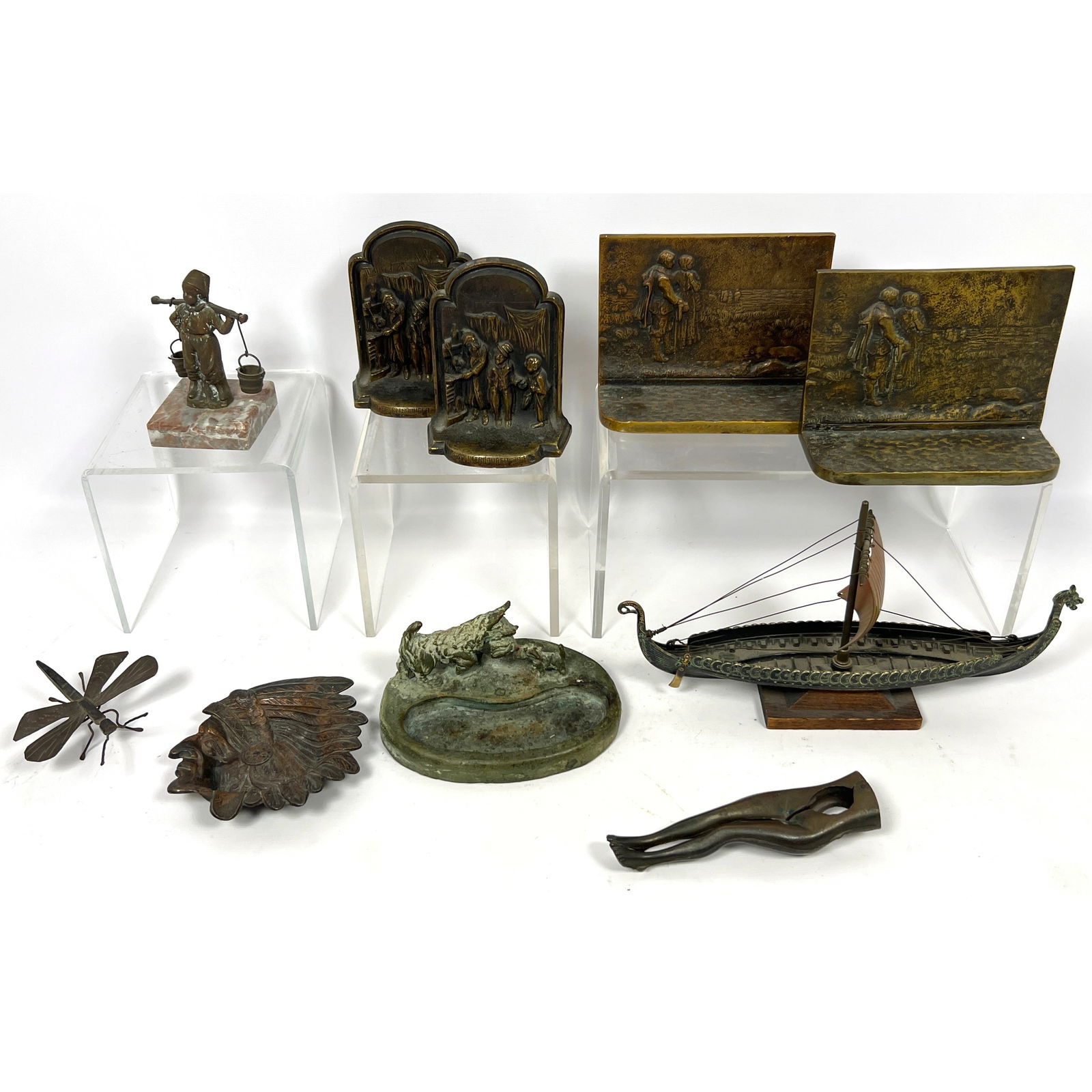 8pc Objects Lot. Metal Viking Ship, Signed Scotty dog dish, American Indian dish, Iron bug, Dickens: 8pc Objects Lot. Metal Viking Ship, Signed Scotty dog dish, American Indian dish, Iron bug, Dickens bookends, Altman Co Bookends, Dimensions: Height: 5.5 inches, Width: 10.25 inches, Depth: 2 inches.