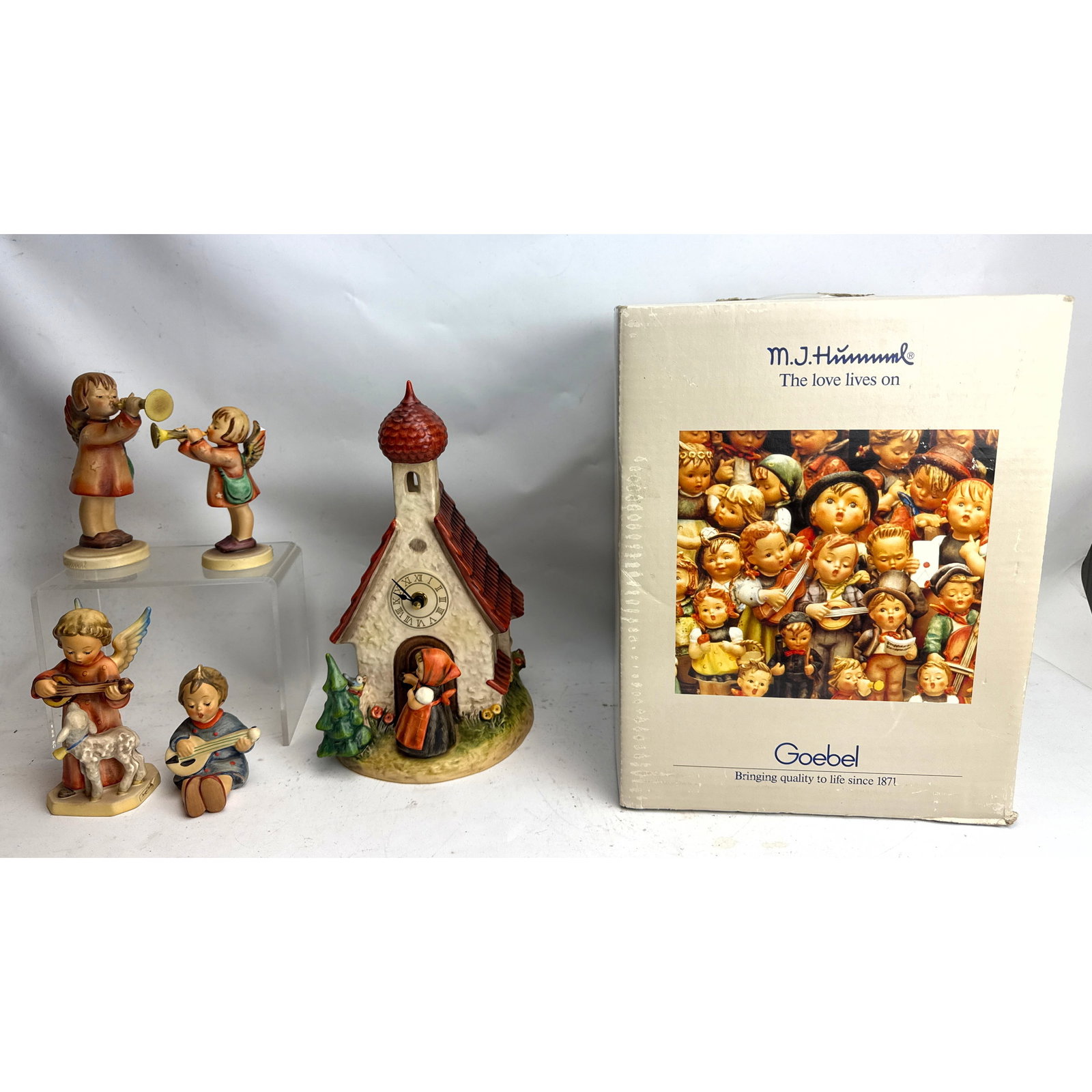 5pcs M.I. Hummel Goebel Chapel Time and more. 358 and 330/0), one angel with a lamb playing a string: 5pcs M.I. Hummel Goebel Chapel Time and more. 358 and 330/0), one angel with a lamb playing a stringed instrument (impressed model number 83), and one seated boy playing a stringed instrument (impress