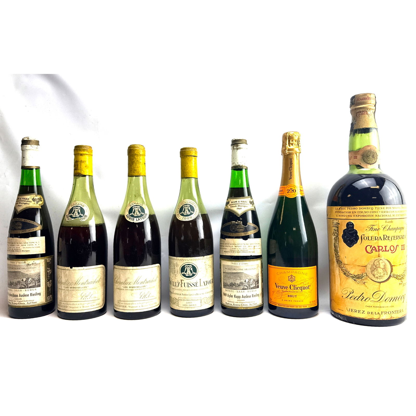7 Bottles Wine, Champagne, Burgundy-style bottles from Louis Latour, comprising "Chevalier Montrache: 7 Bottles Wine, Champagne, Burgundy-style bottles from Louis Latour, comprising "Chevalier Montrachet" and "Pouilly-Fuisse Latour" varieties, with at least two bearing the vintage "1969." Rhine-style