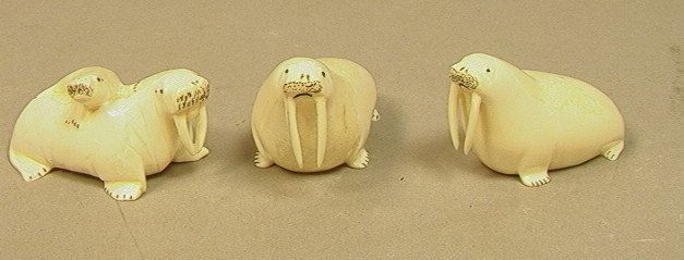 Lot 3pc Carved Alaskan Ivory Walrus Figures. Walr: Lot 3pc Carved Alaskan Ivory Walrus Figures. Walruses. Two signed JOSEPH LYAHUK. Sculpture of Mom & Baby Walrus Signed R. MENADLONK-- Dimensions: H: 1.75 inches: W: 3 inches --- US Shipping charge: $1