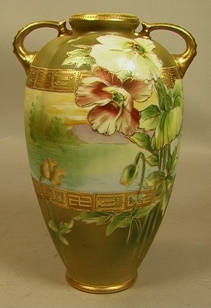 NIPPON Hand Painted Porcelain Handled Vase. Paint: NIPPON Hand Painted Porcelain Handled Vase. Painted Landscape Band with Poppies. Raised gilt paint trim & decoration. Marked. -- Dimensions: H: 9.5 inches: W: 5.5 inches: D: 4.5 inches --- US Shipping