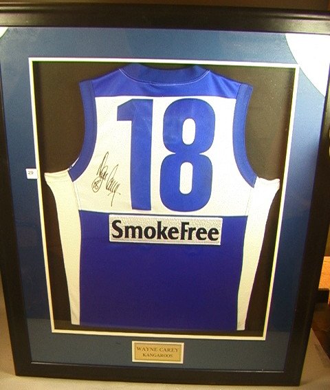 18 Wayne Carey - Kangaroos Jersey Australian rules fb: KANGAROOS Wayne Carey autographed Jersey. Australian rules football. Blue Number-- Dimensions: H: 43 inches: W: 34 inches ---