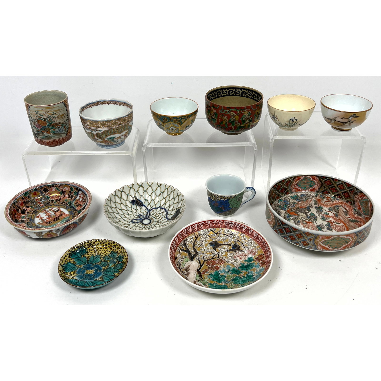 12pcs Japanese porcelain and ceramic wares, executed in various styles primarily associated with the (1 of 20)